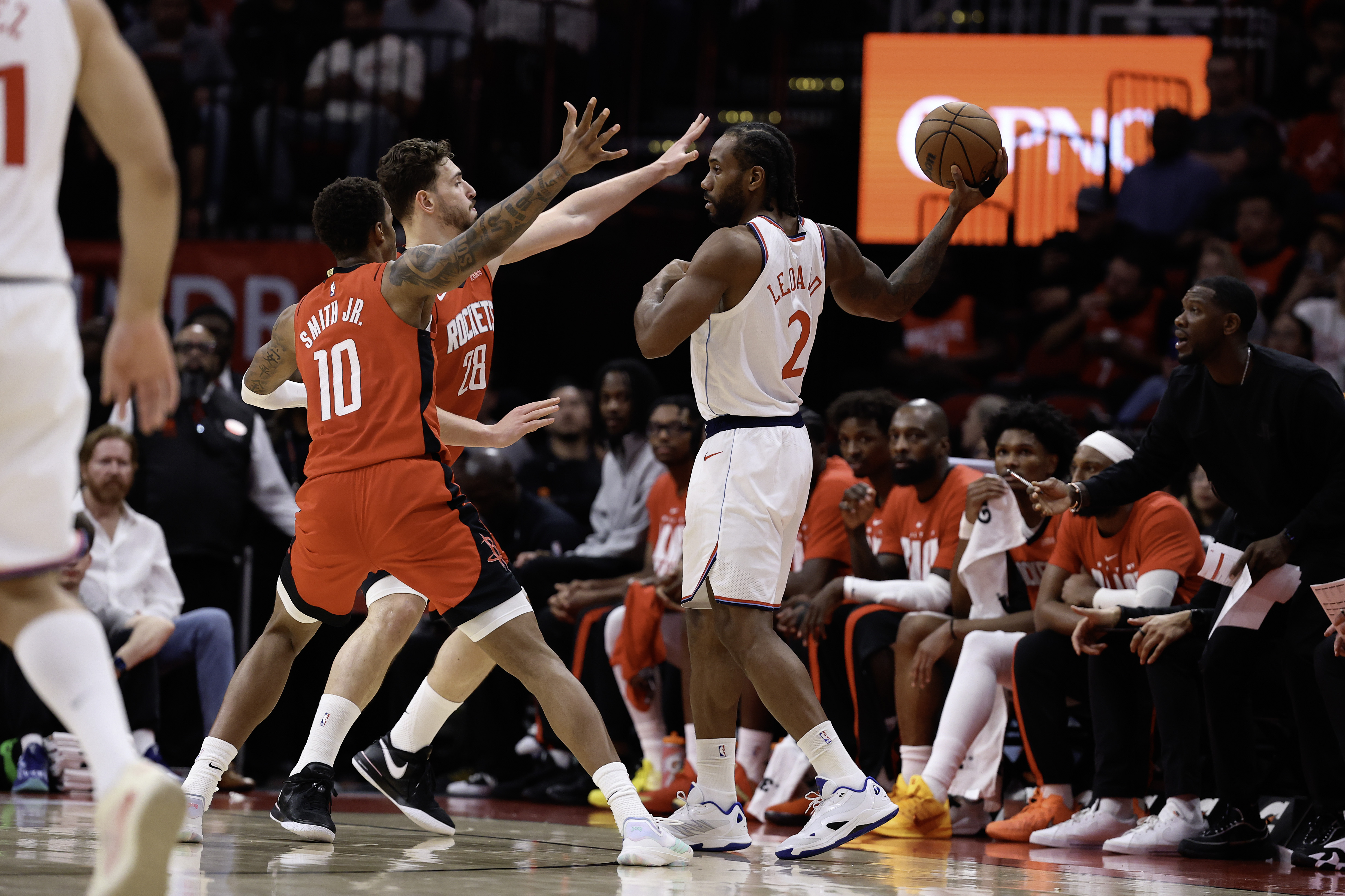 Clippers star Kawhi Leonard looks to pass the ball as...