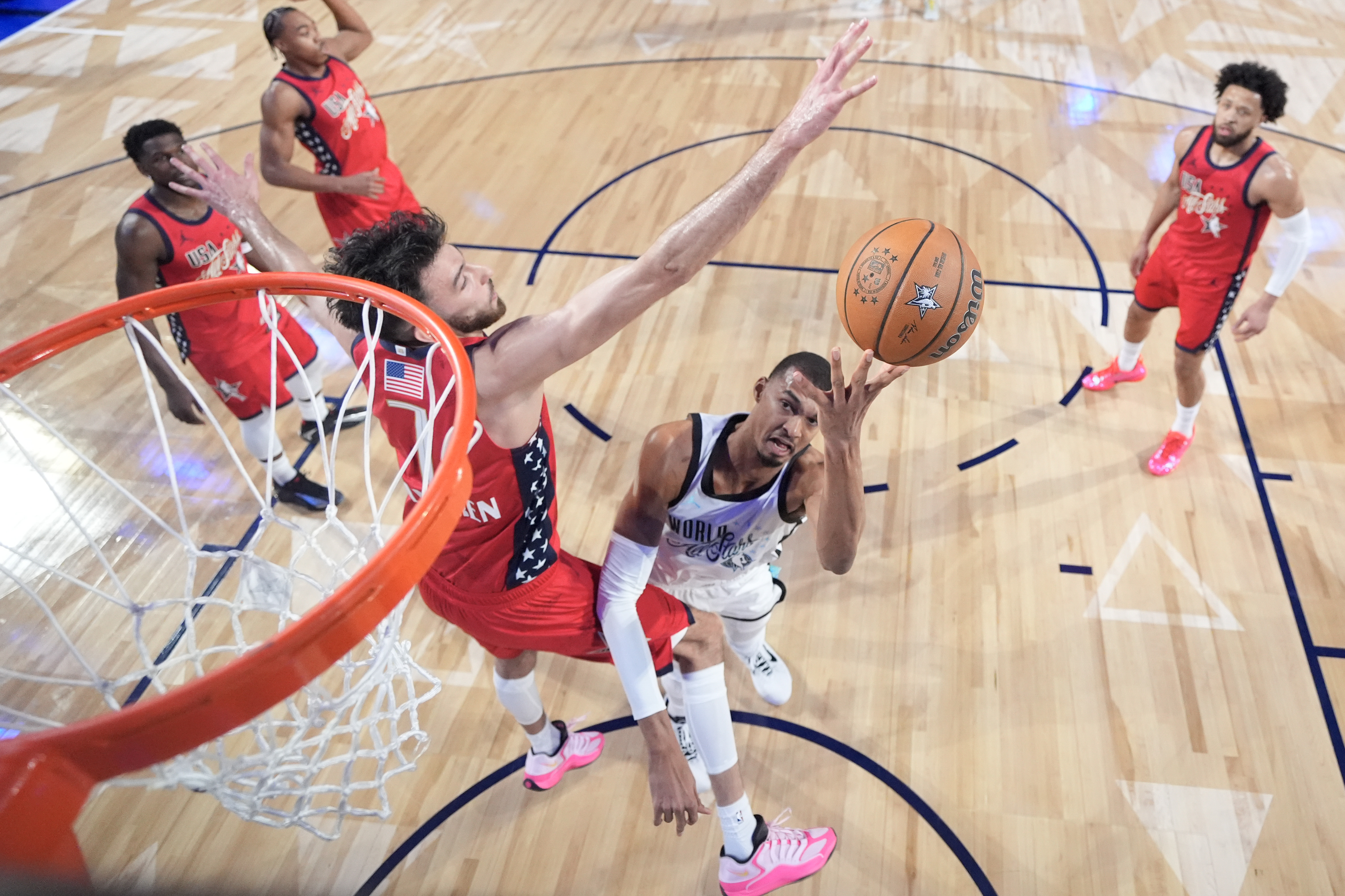 San Antonio Spurs star Victor Wembanyama of Team World shoots...