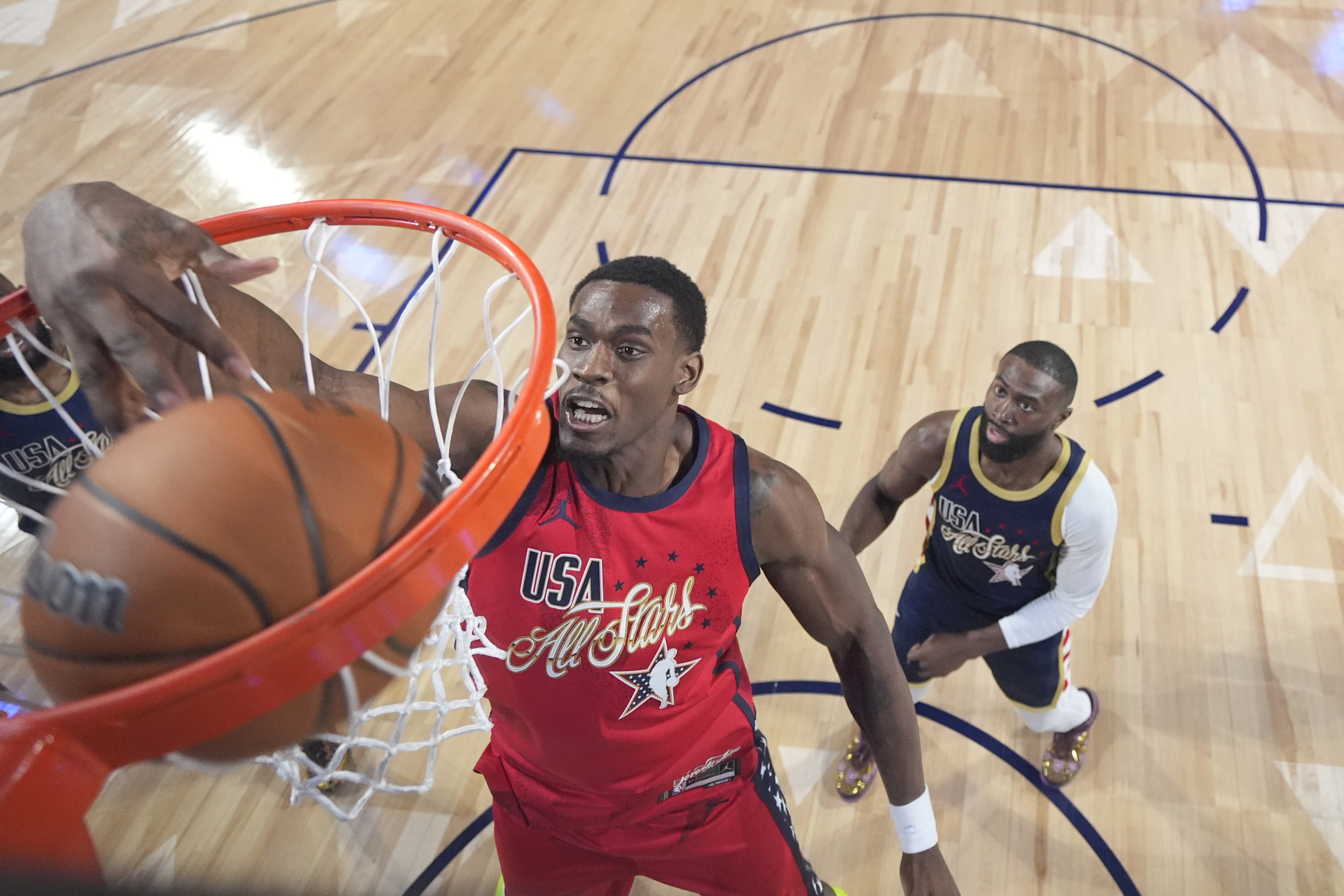 The Detroit Pistons’ Jalen Duren of Team USA Stars dunks...