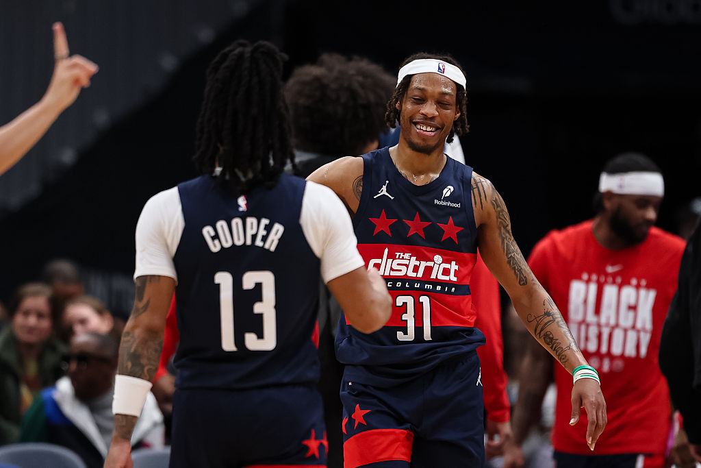 WASHINGTON, DC - FEBRUARY 20: Alondes Williams #31 and Sharife Cooper #13 of the Washington Wizards celebrate after a play against the Indiana Pacers during the second half at Capital One Arena on February 20, 2026 in Washington, DC.
