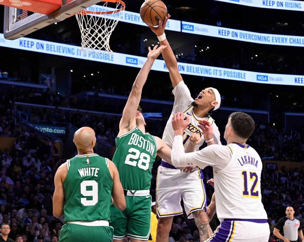 Jaxson Hayes of the Los Angeles Lakers shoots over Hugo Gonzalez of the Boston Celtics.