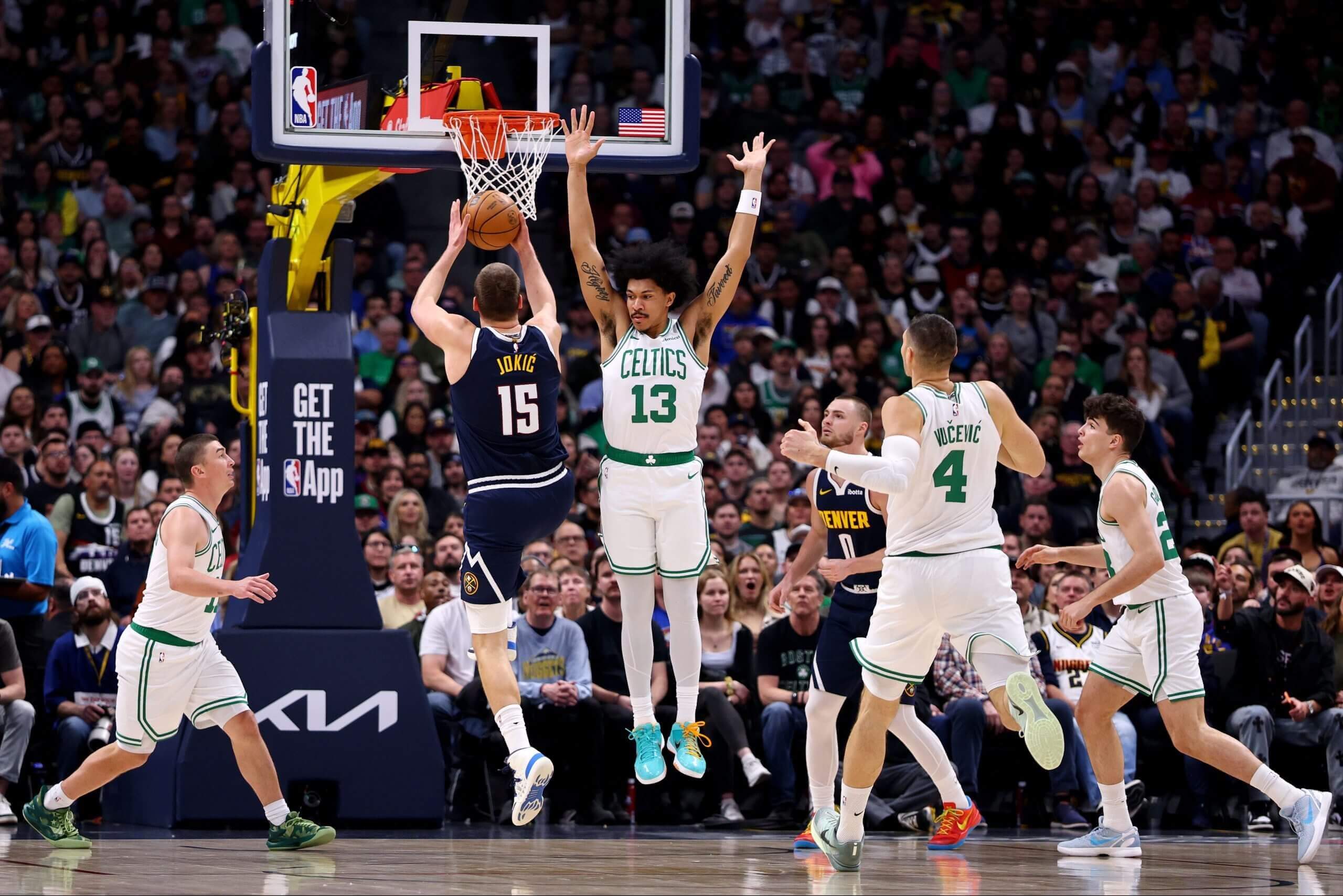 Denver's Nikola Jokic takes a shot against Boston.