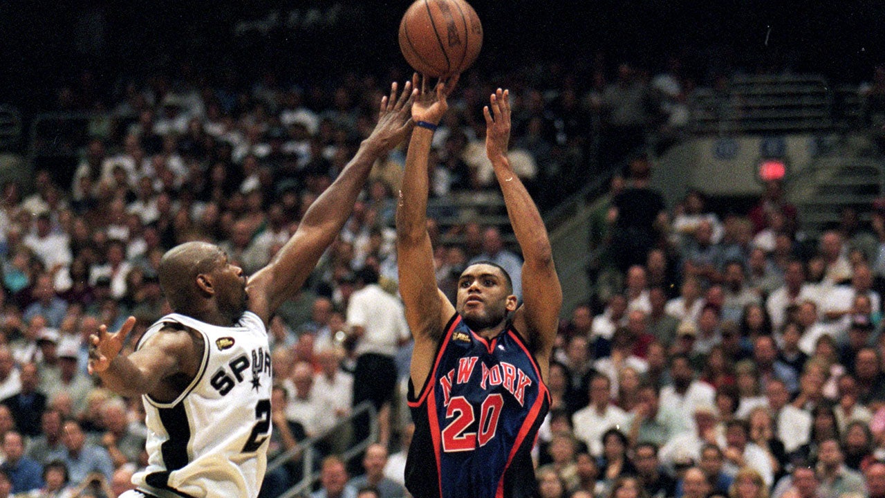 16 Jun 1999: Allan Houston #20 of the New York Knicks puts up a shot over Jaren Jackson #2 of the San Antonio Spurs during game one of the NBA Finals at the Alamodome in San Antonio, Texas. Mandatory Credit: Todd Warshaw /Allsport