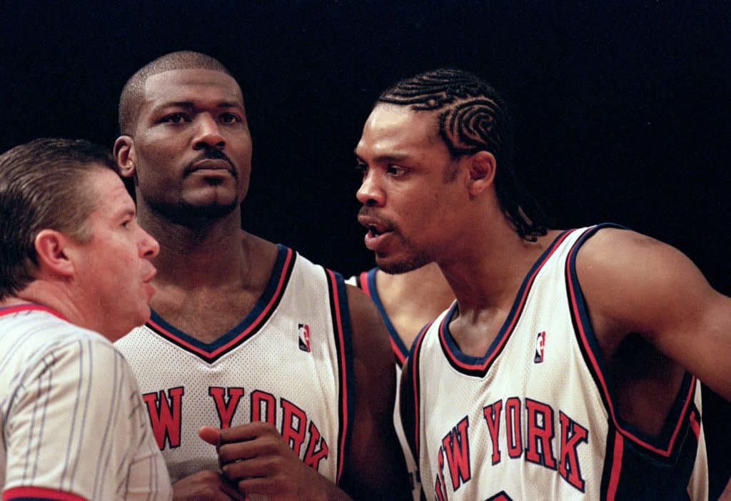 23 Apr 2000: Latrell Sprewell #8 of the New York Knicks and Larry Johnson #2 talk to the referee during the NBA Eastern Conference Round One Game against the Toronto Raptors at Madison Square Garden in New York New York. The Knicks defeated the Raptors 92-88 .   