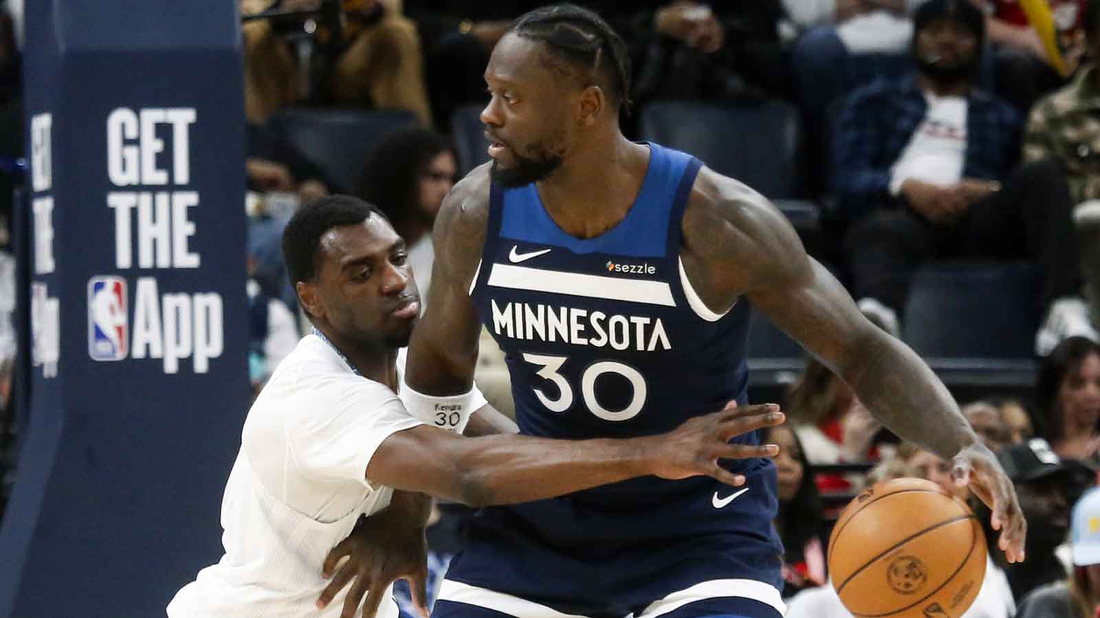 Minnesota Timberwolves forward Julius Randle (30) dribbles as Memphis Grizzlies forward Vince Williams Jr. (5) defends during the second quarter at FedExForum. 