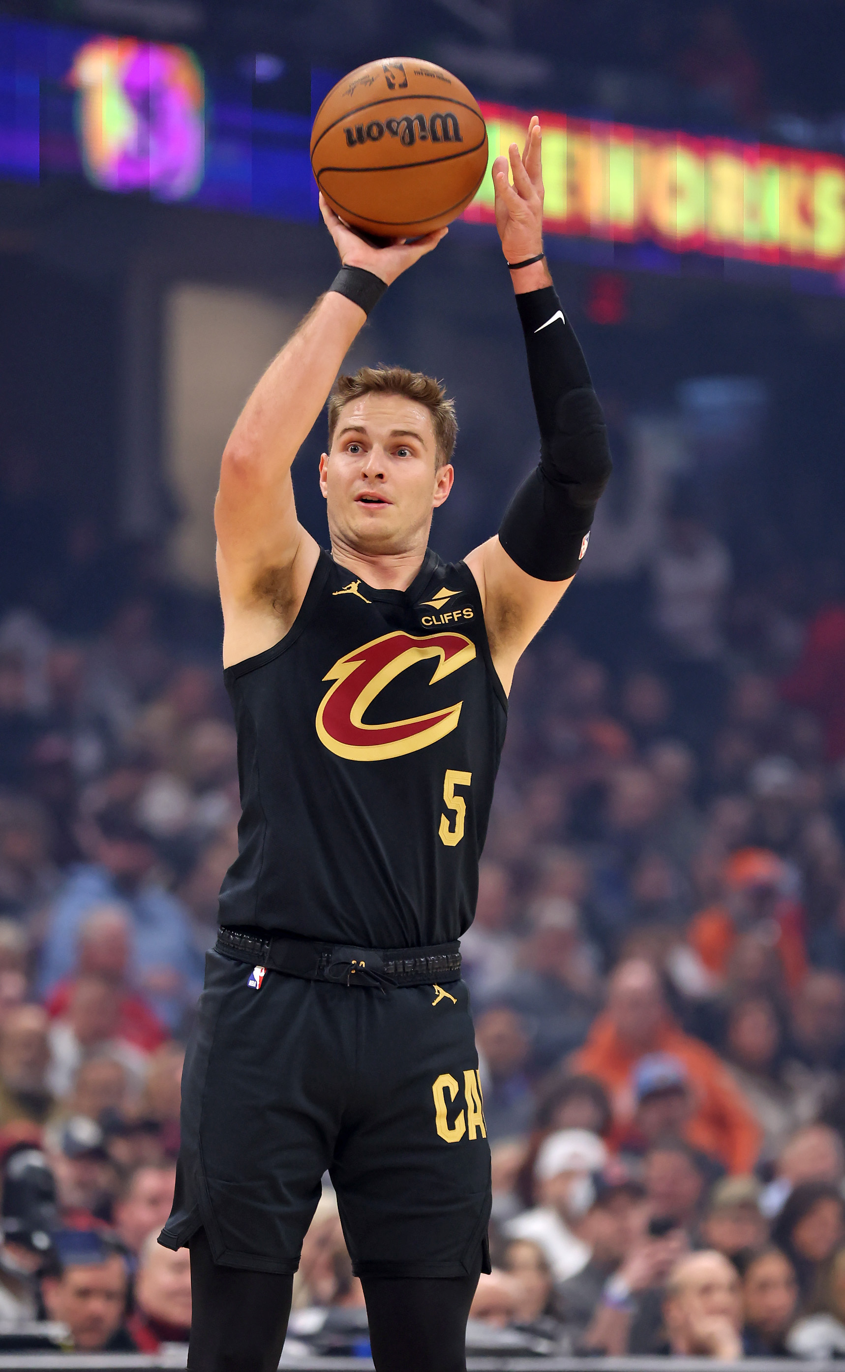 Cleveland Cavaliers guard Sam Merrill shoots a three against the Washington Wizards in the first half of play. 