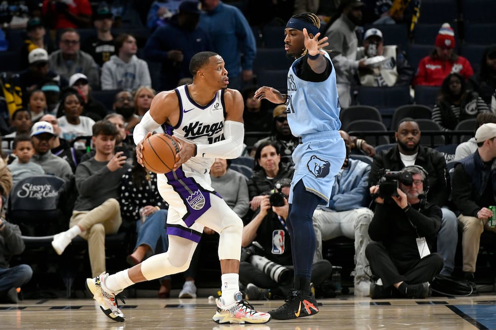 Sacramento Kings guard Russell Westbrook, left, handles the ball against Memphis Grizzlies...
