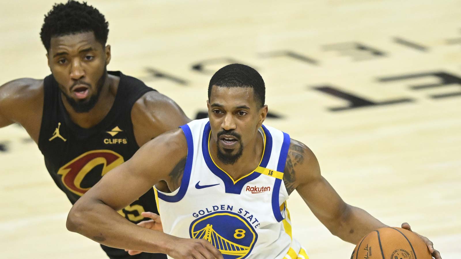 Golden State Warriors guard De'Anthony Melton (8) drives beside Cleveland Cavaliers guard Donovan Mitchell (45) in the fourth quarter at Rocket Mortgage FieldHouse.