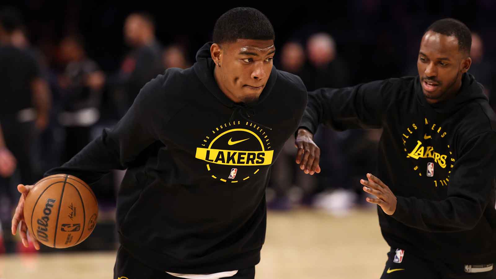 Los Angeles Lakers forward Rui Hachimura (left) warms up before the game against the Atlanta Hawks at Crypto.com Arena.