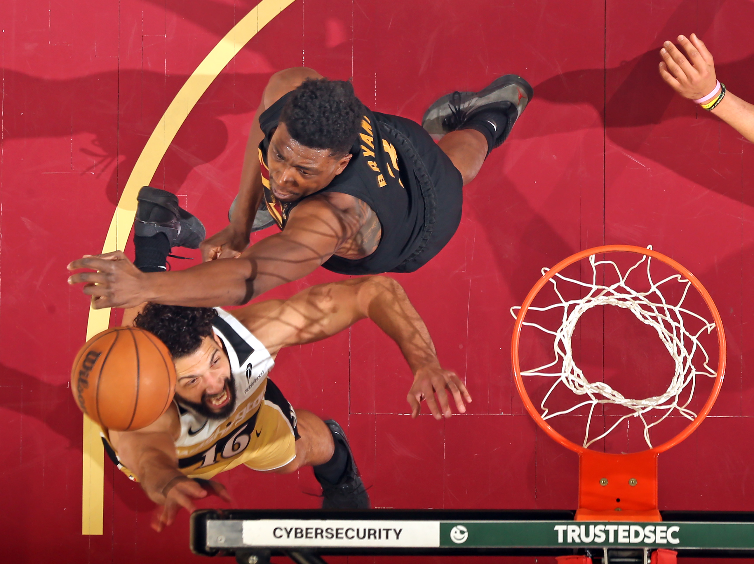 Cleveland Cavaliers center Thomas Bryant knocks a shot away from Washington Wizards forward Anthony Gill in the first half of play. 