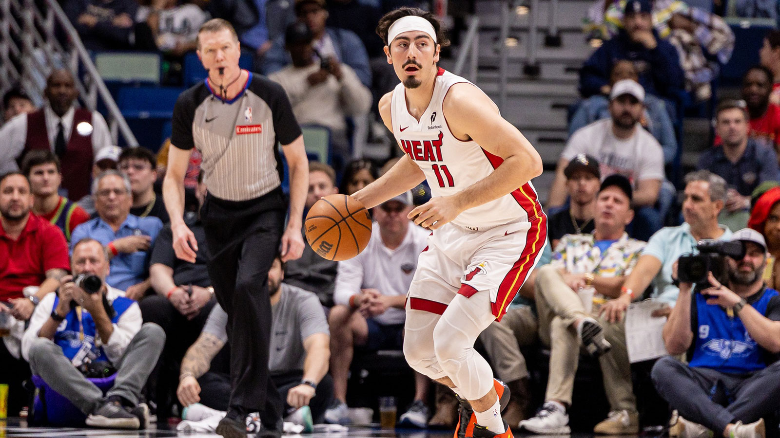 Miami Heat guard Jaime Jaquez Jr. (11) brings the ball up court against the New Orleans Pelicans during the first half at Smoothie King Center.