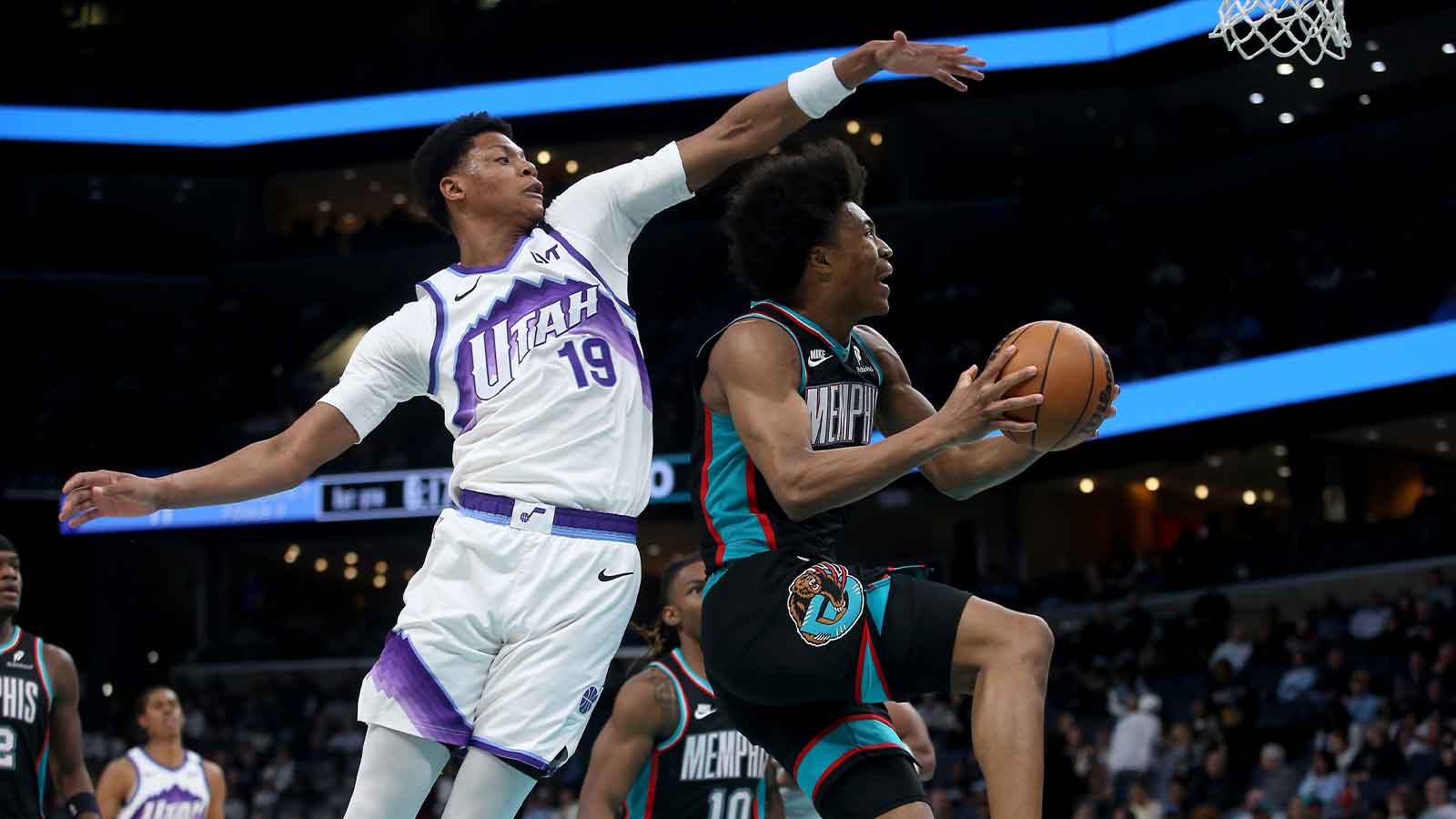 Memphis Grizzlies forward Jaylen Wells (0) drives against Utah Jazz guard Ace Bailey (19) during the first quarter at FedExForum.