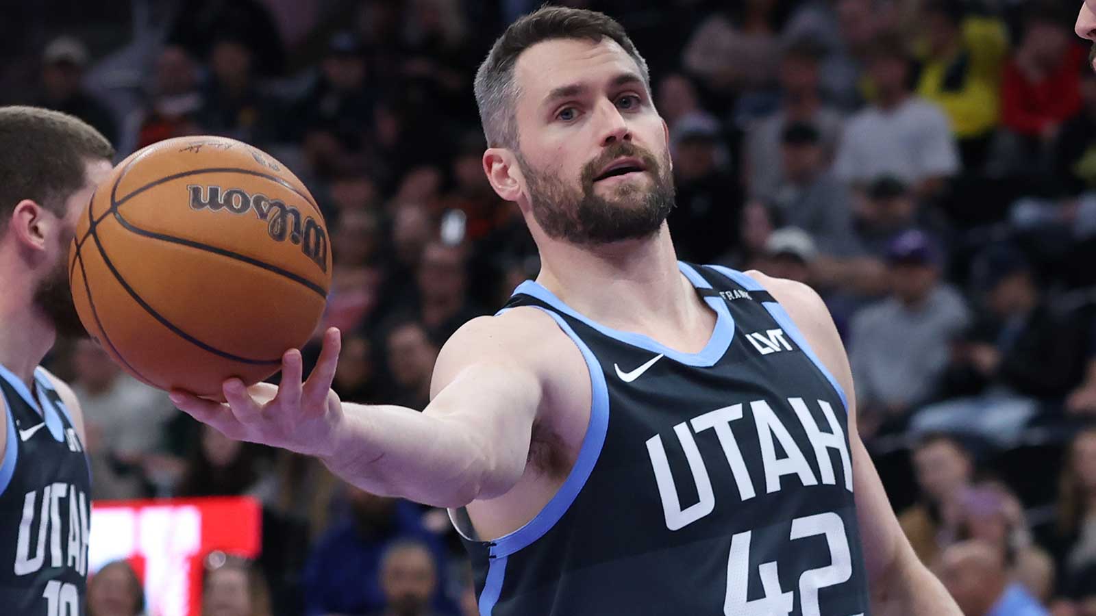 Jazz forward Kevin Love (42) reacts after a play against the Oklahoma City Thunder during the first half at Delta Center