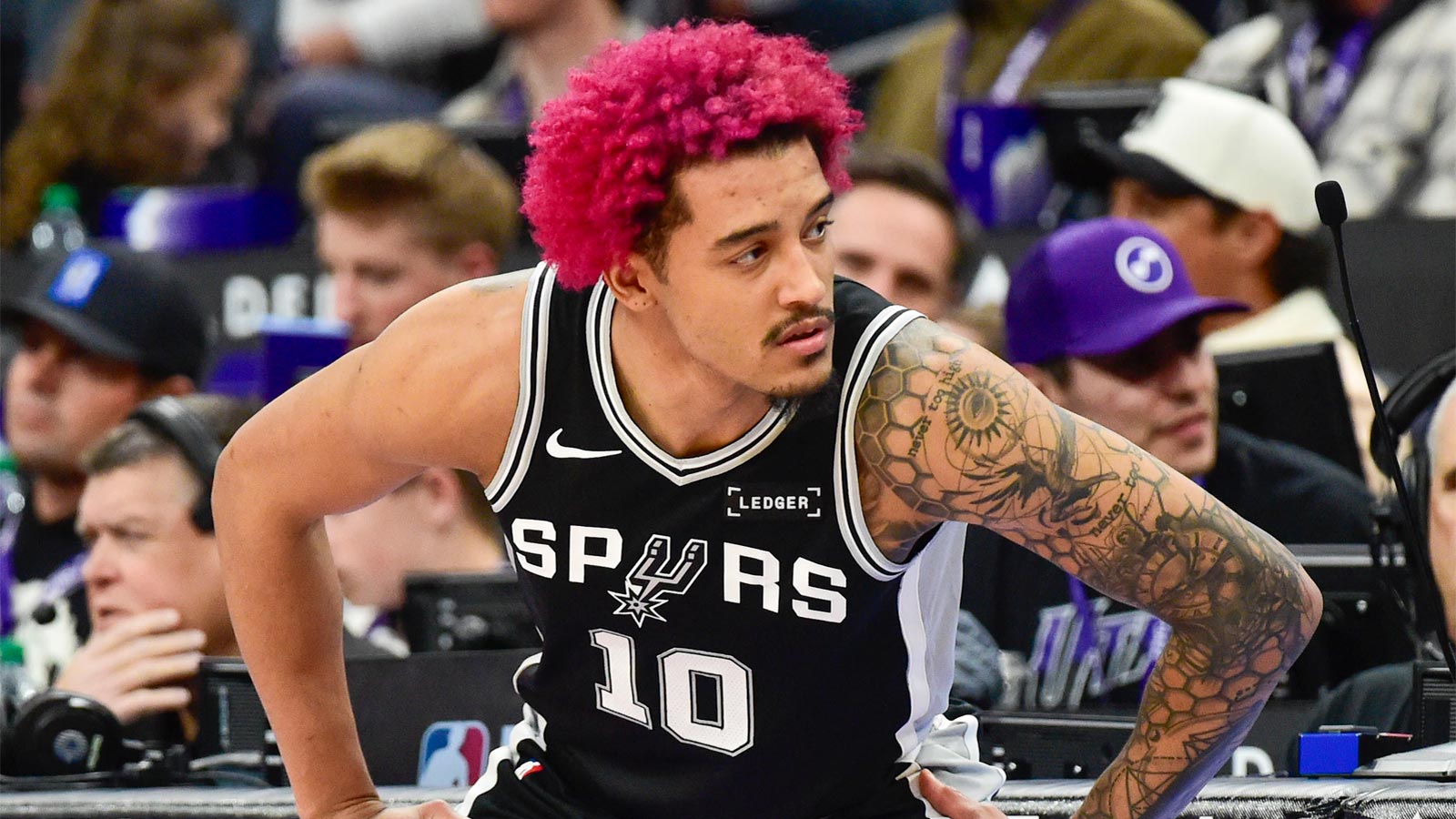 San Antonio Spurs forward Jeremy Sochan (10) stretches before substituting in during the second half against the Utah Jazz at Delta Center.