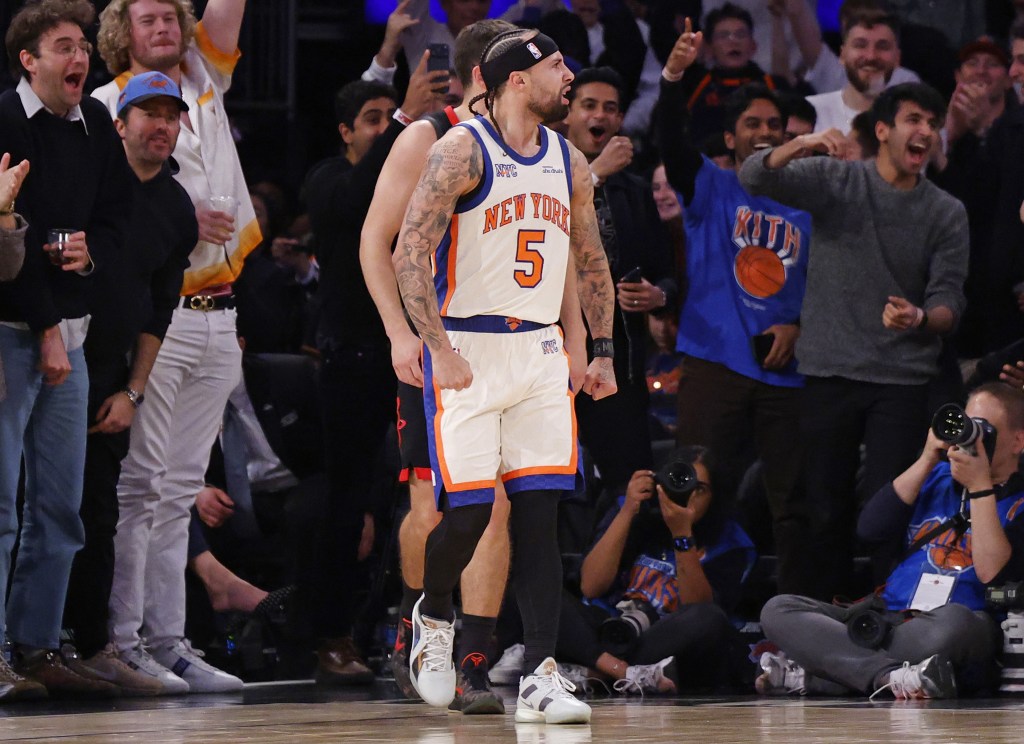 Jose Alvarado celebrates with the fans after making a bucket during the second half of the Knicks' comeback win over the Rockets.
