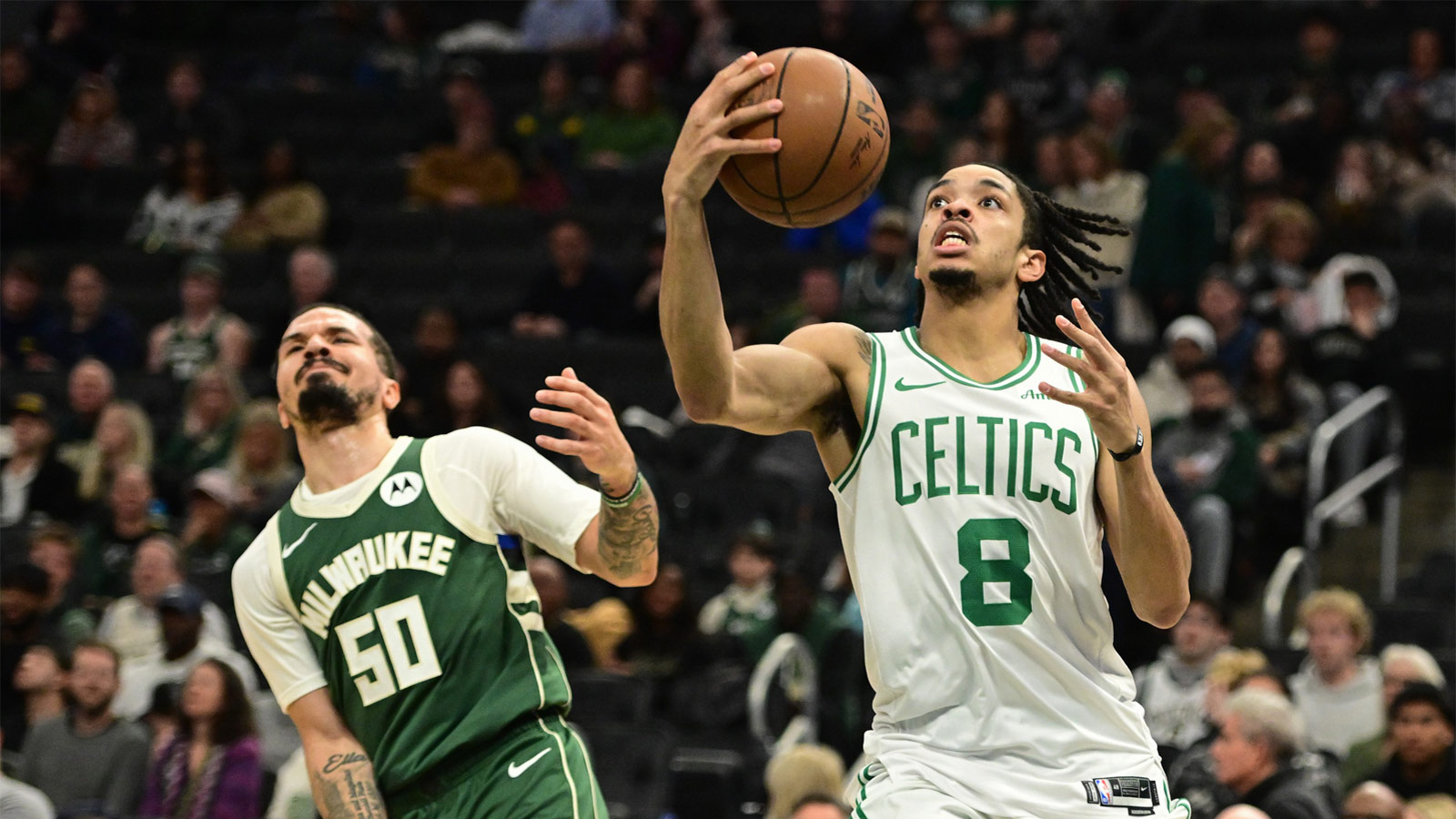 Boston Celtics forward Josh Minott (8) looks for a shot against Milwaukee Bucks guard Cole Anthony (50) in the fourth quarter at Fiserv Forum.