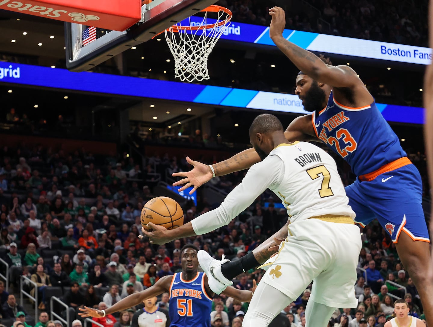 The Celtics' Jaylen Brown ran into defensive pressure from Knicks center Mitchell Robinson.