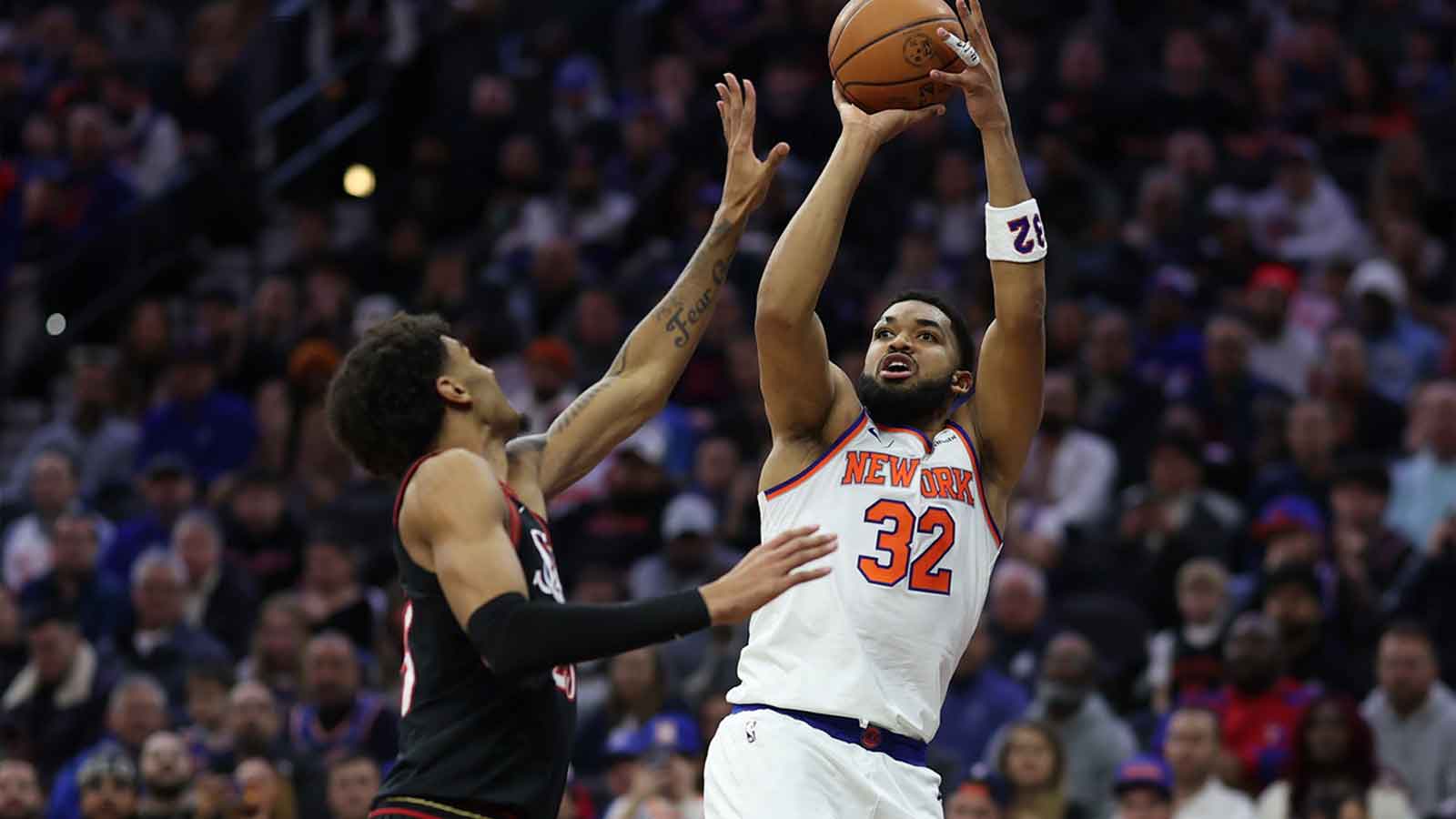 New York Knicks center Karl-Anthony Towns (32) shoots in front of Philadelphia 76ers forward Dominick Barlow (25) during the first half at Xfinity Mobile Arena.