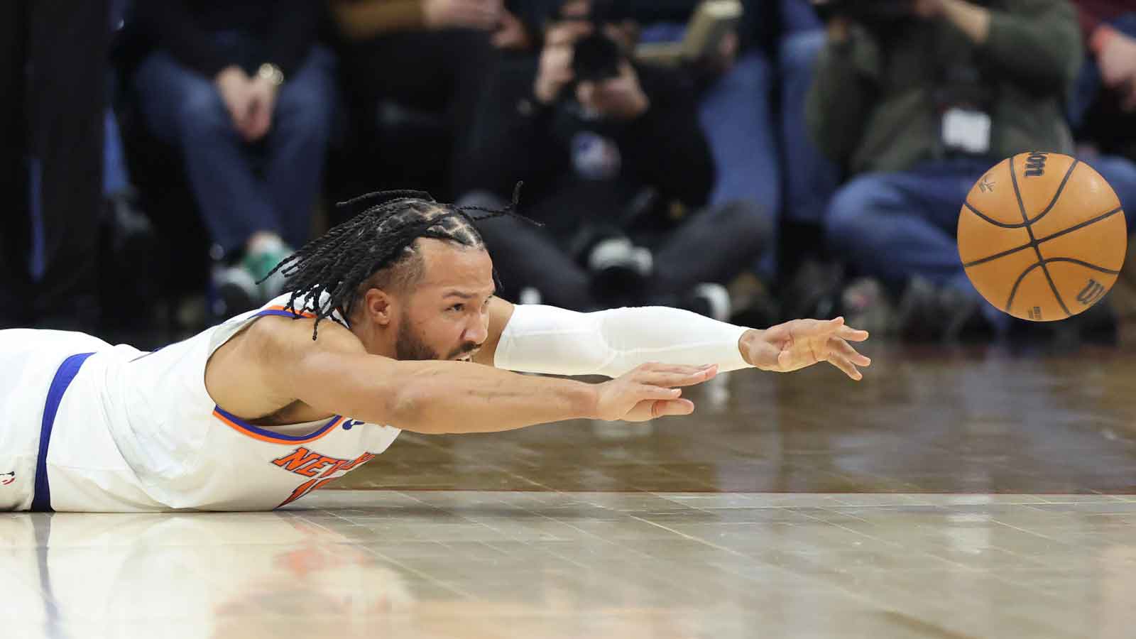 Knicks guard Jalen Brunson (11) passes the ball while face down on the court during the first half against the Philadelphia 76ers at Xfinity Mobile Arena