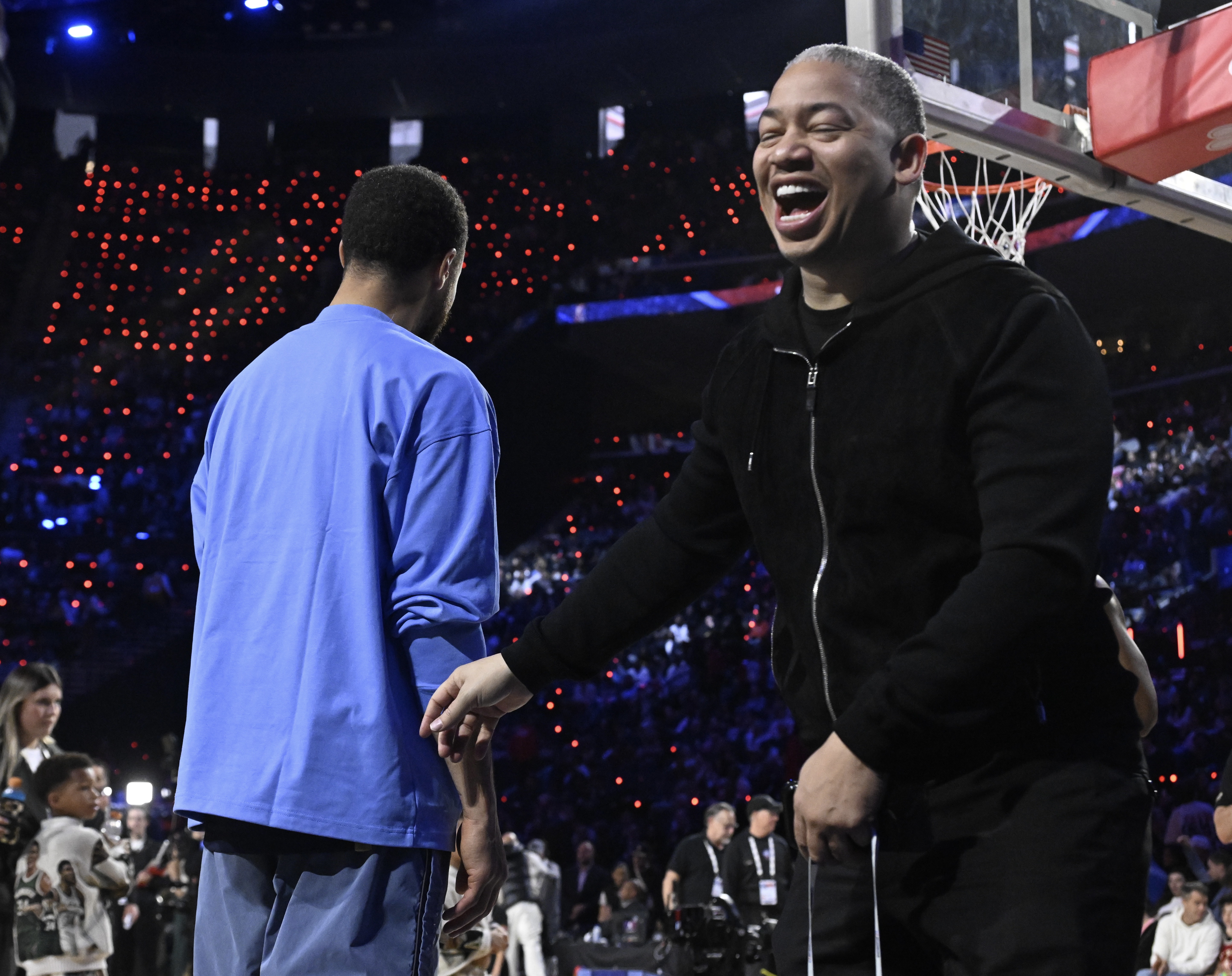 Clippers head coach Tyronn Lue, right, shares a laugh with...