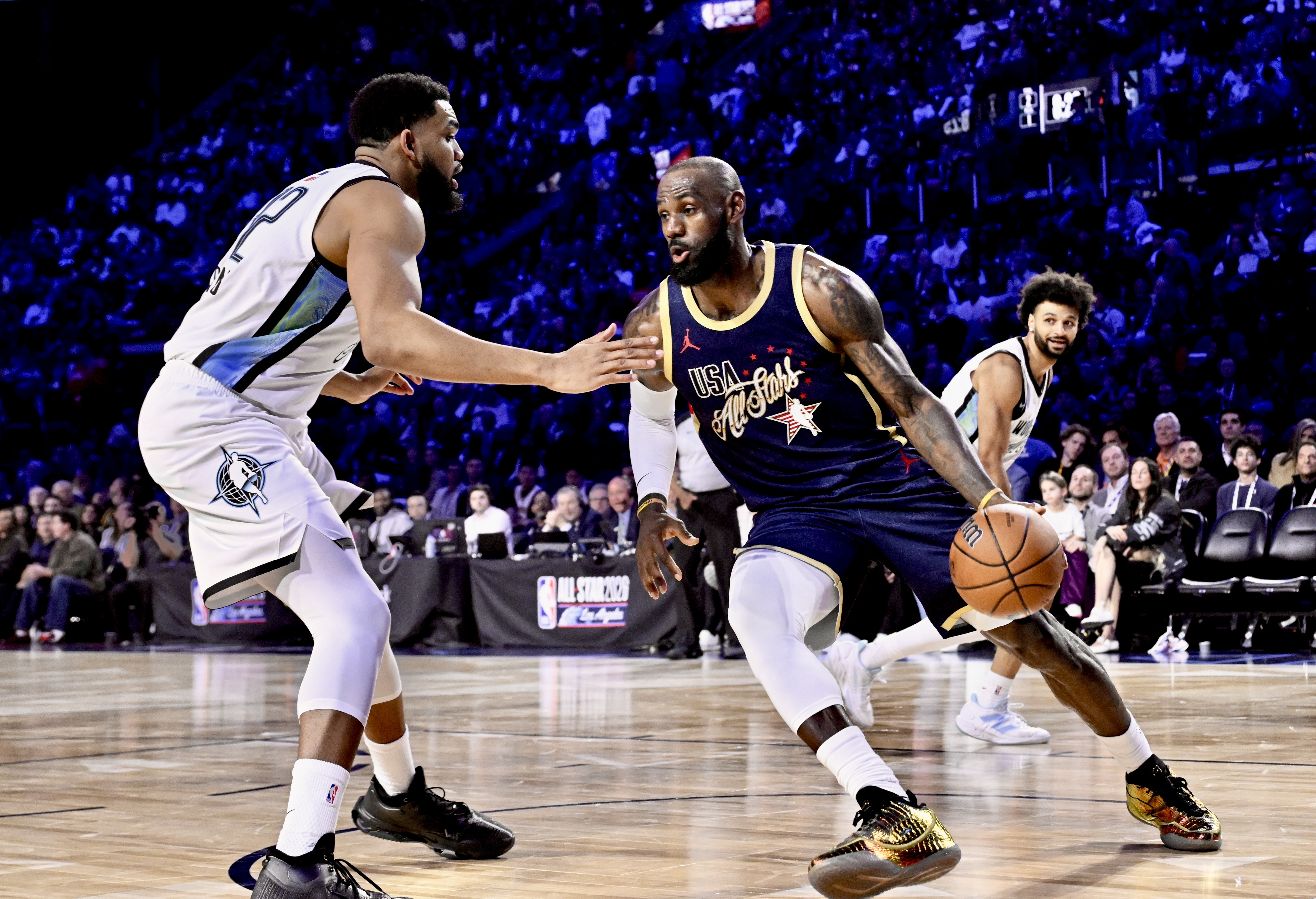 Lakers star LeBron James of Team USA Stripes drives past...