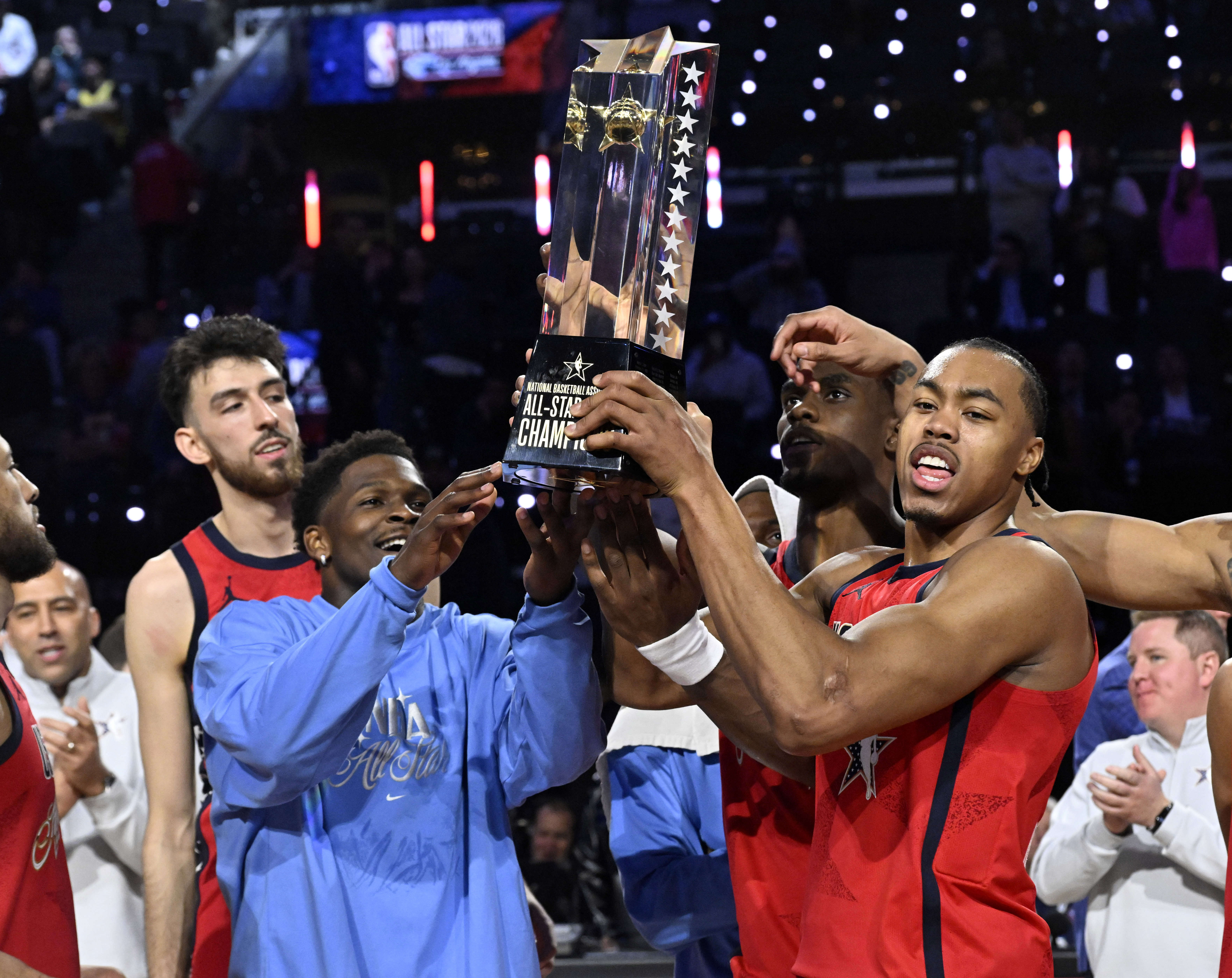 Minnesota Timberwolves guard Anthony Edwards, left, and Toronto Raptors star...