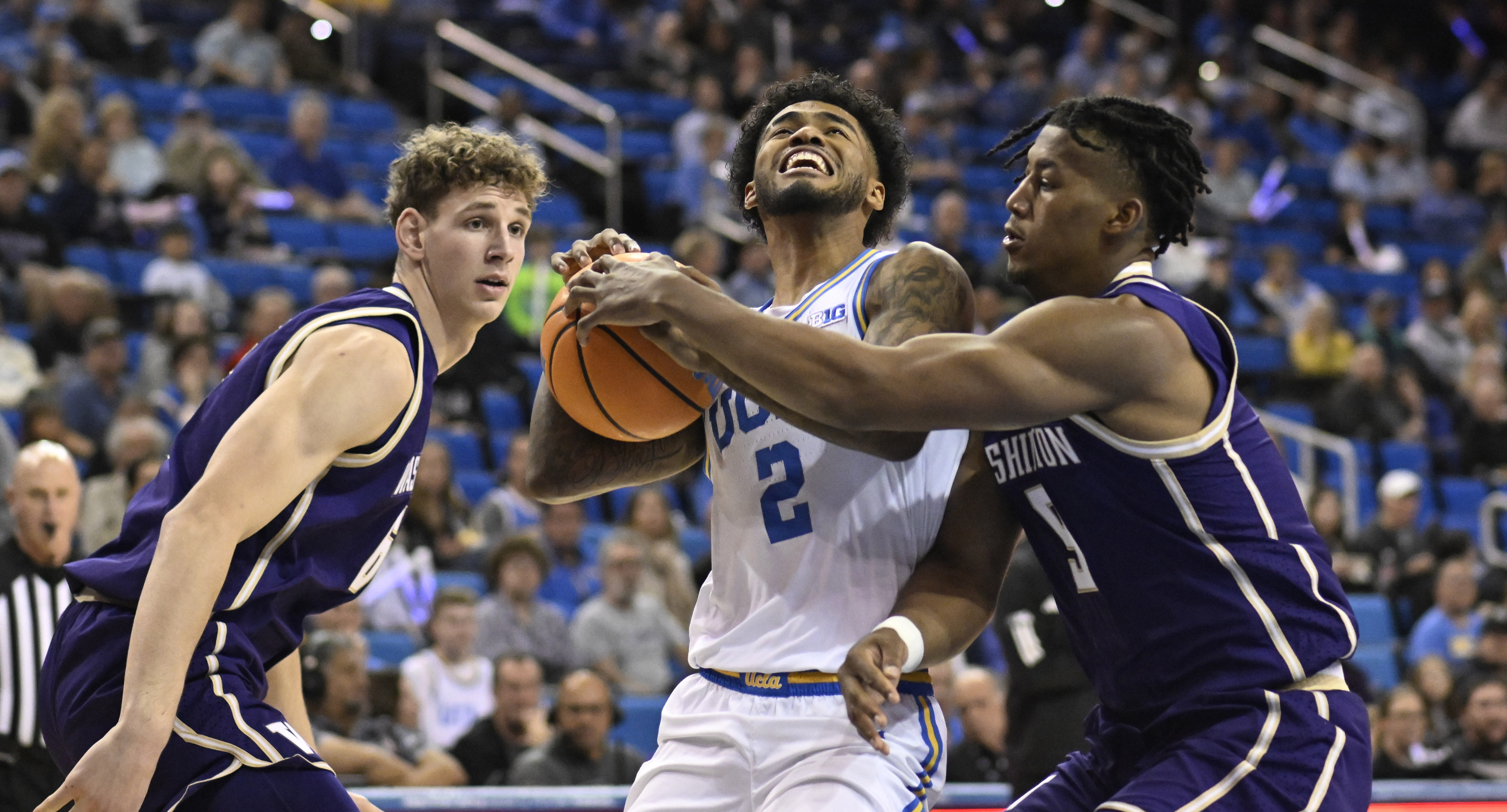 Guard Donovan Dent #2 of the UCLA Bruins drives to...