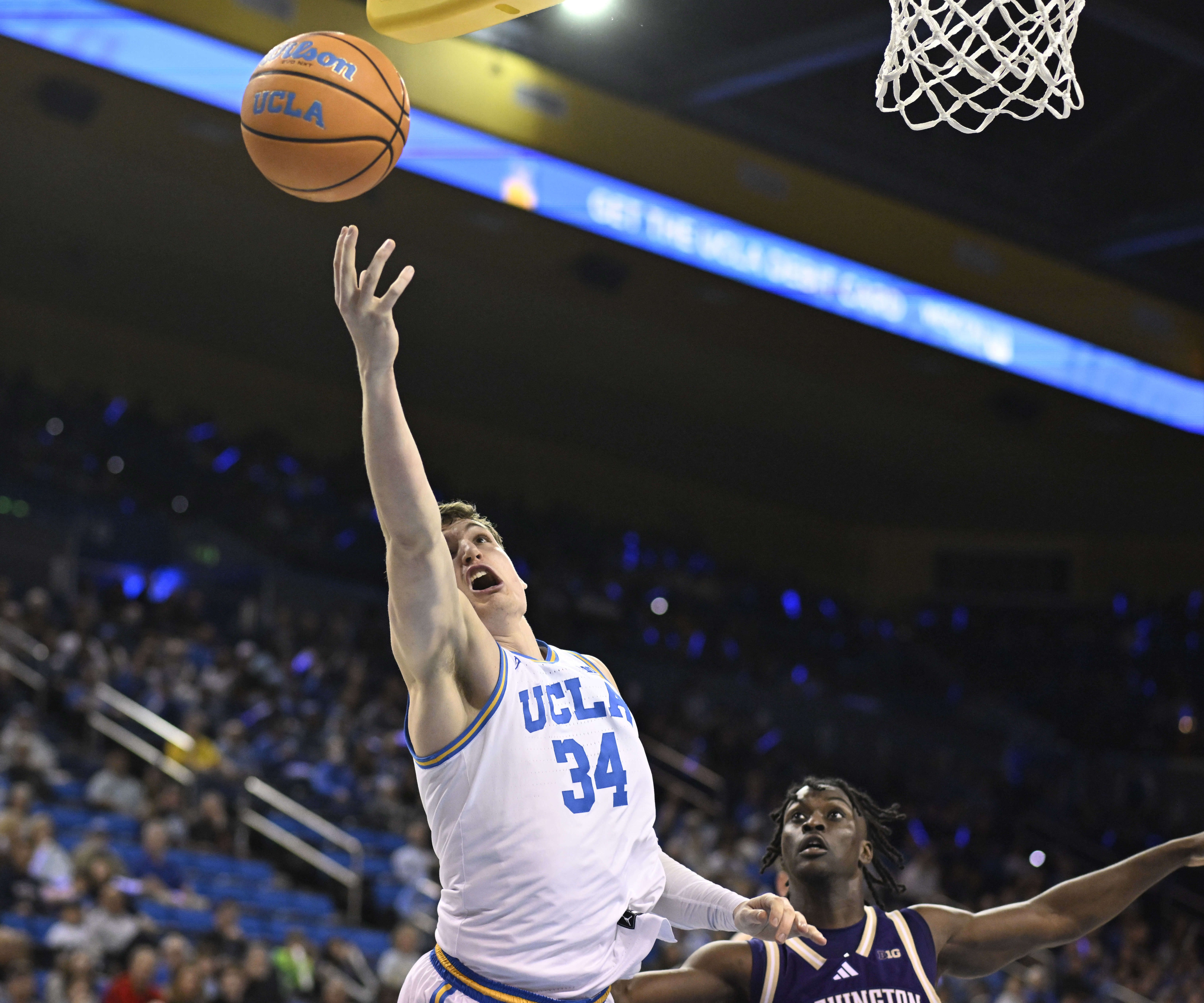 Forward Eric Dailey Jr. #3 of the UCLA Bruins4 drives...