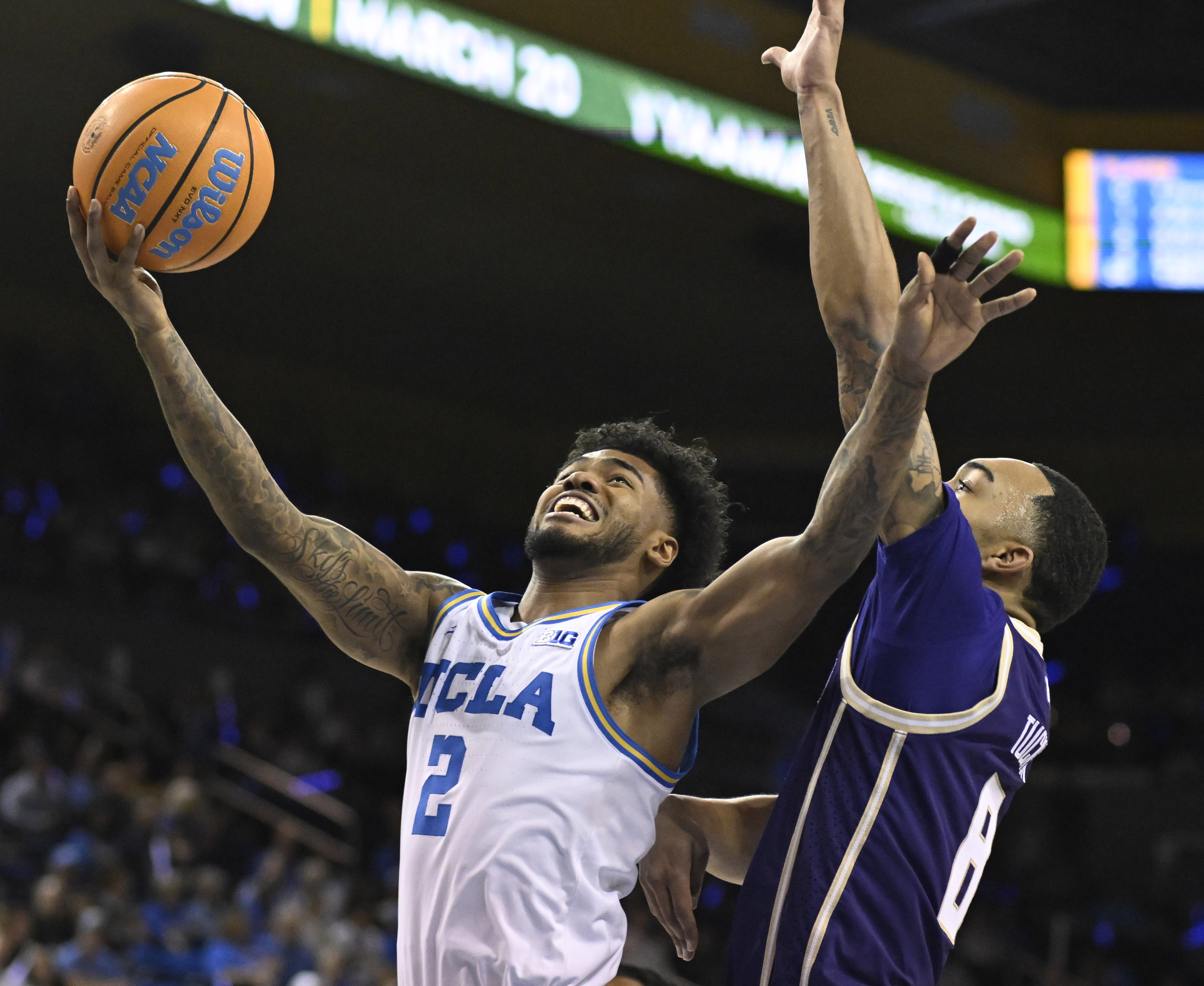 Guard Donovan Dent #2 of the UCLA Bruins drives to...