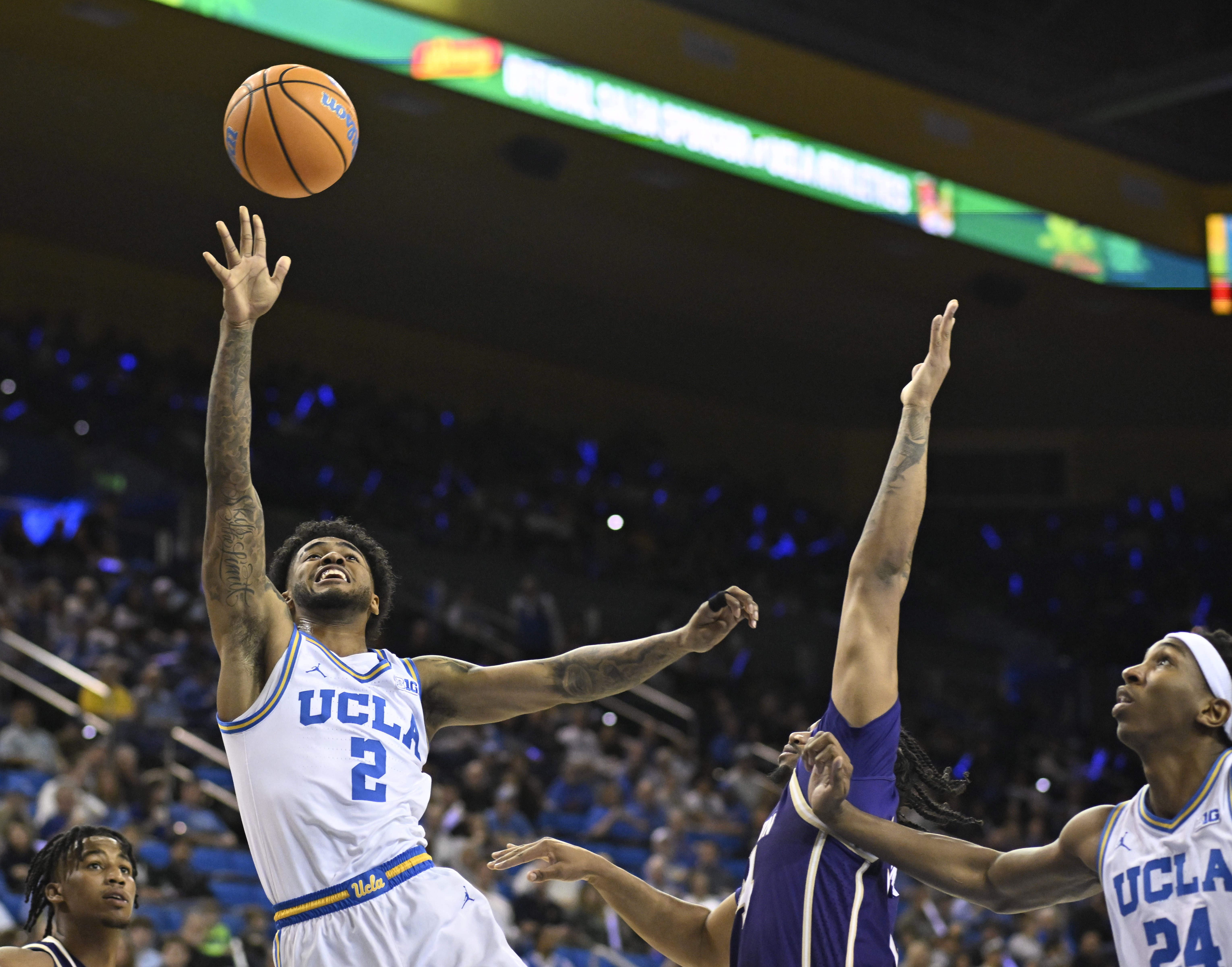 Guard Donovan Dent #2 of the UCLA Bruins shoots against...