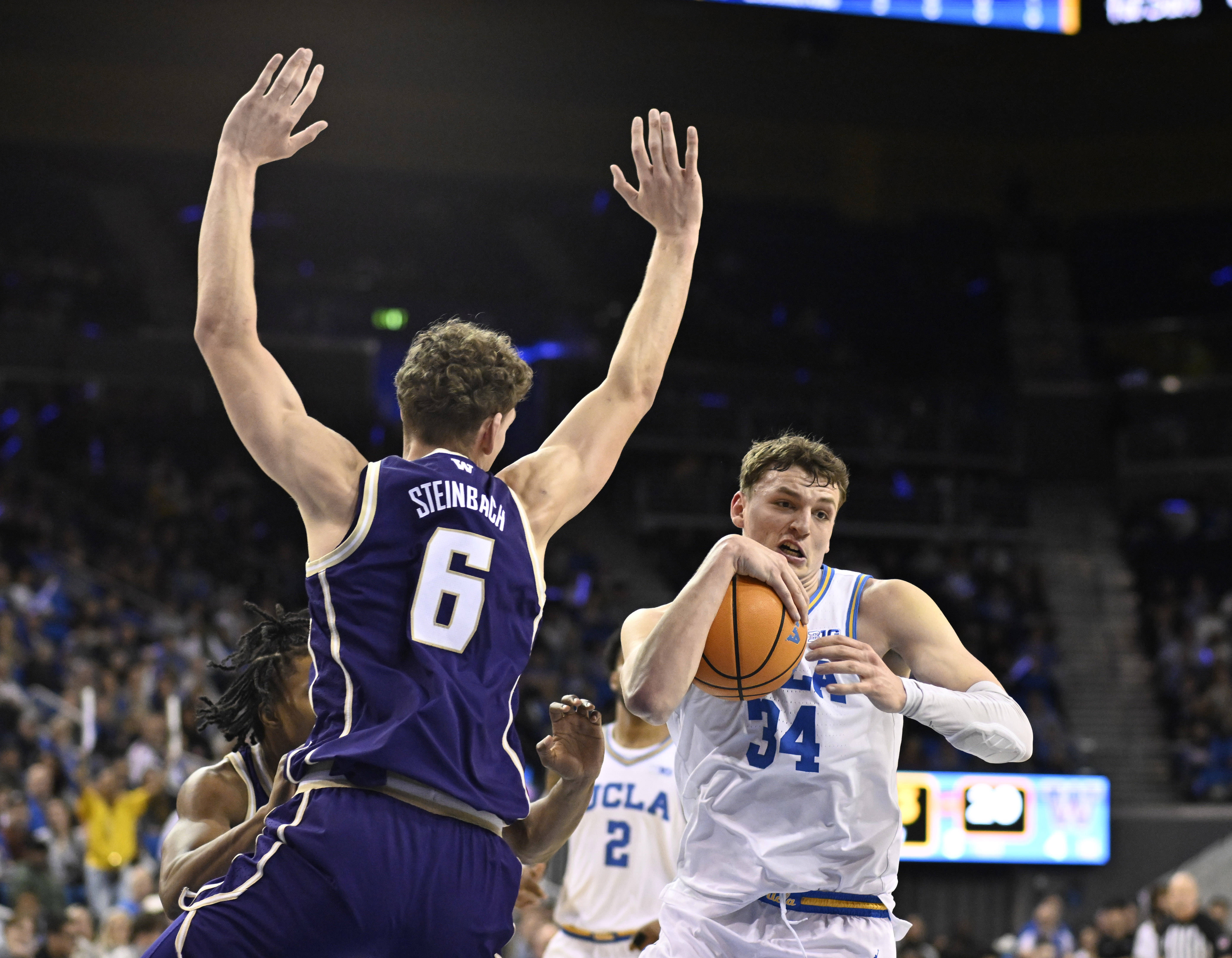 Forward Tyler Bilodeau #34 of the UCLA Bruins drives to...