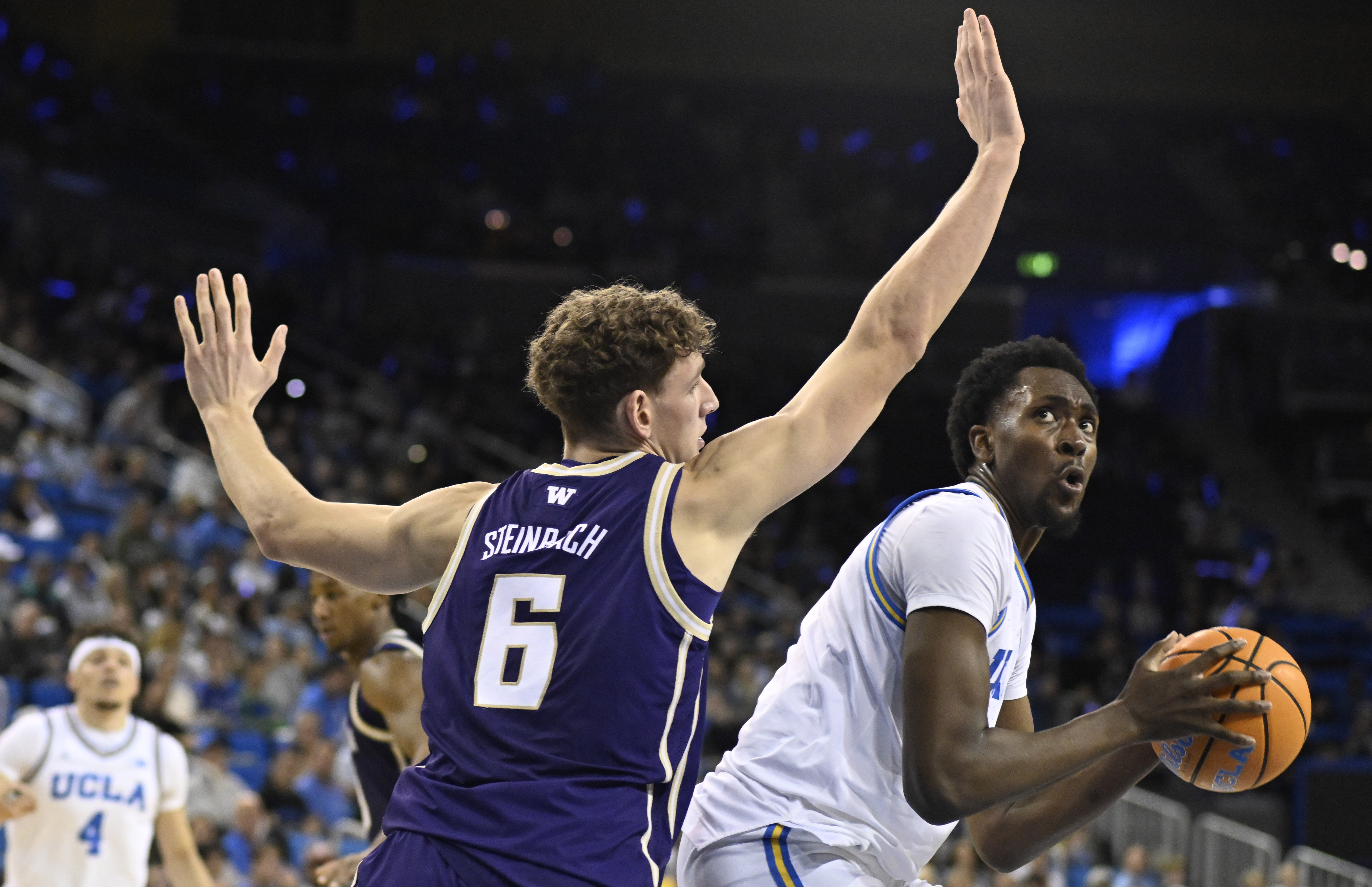 Center Xavier Booker #1 of the UCLA Bruins drives to...