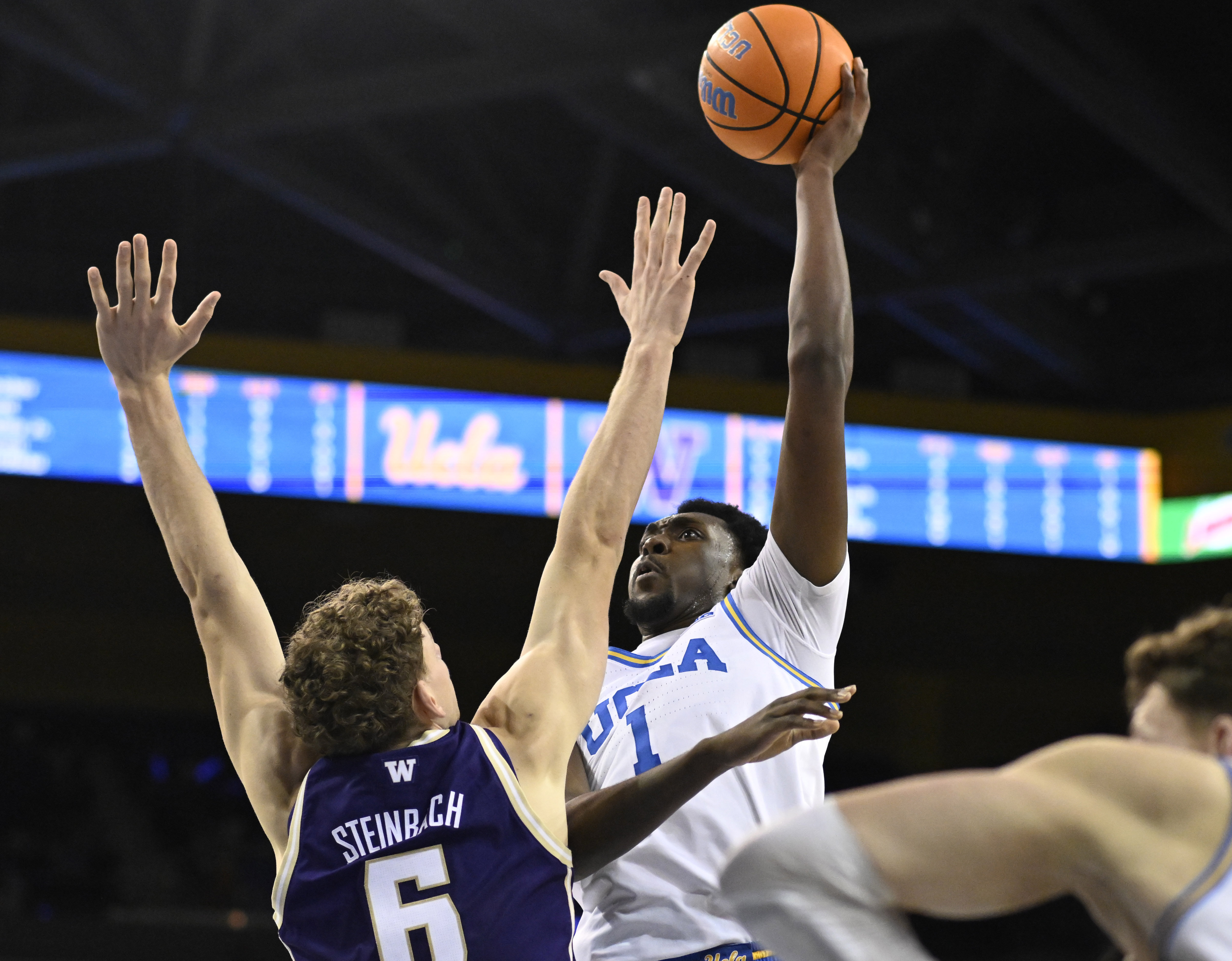 Center Xavier Booker #1 of the UCLA Bruins drives to...