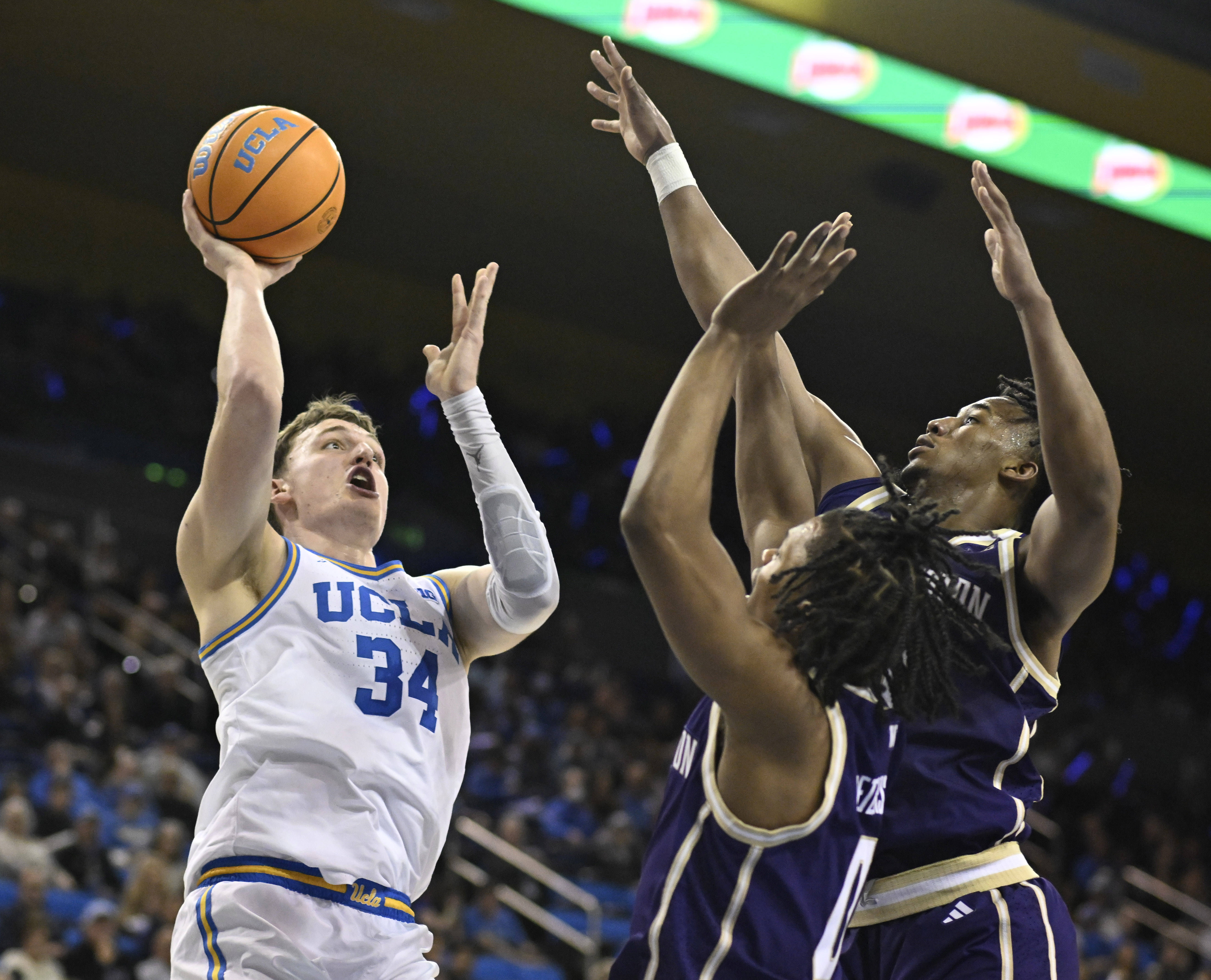 Forward Tyler Bilodeau #34 of the UCLA Bruins shoots over...