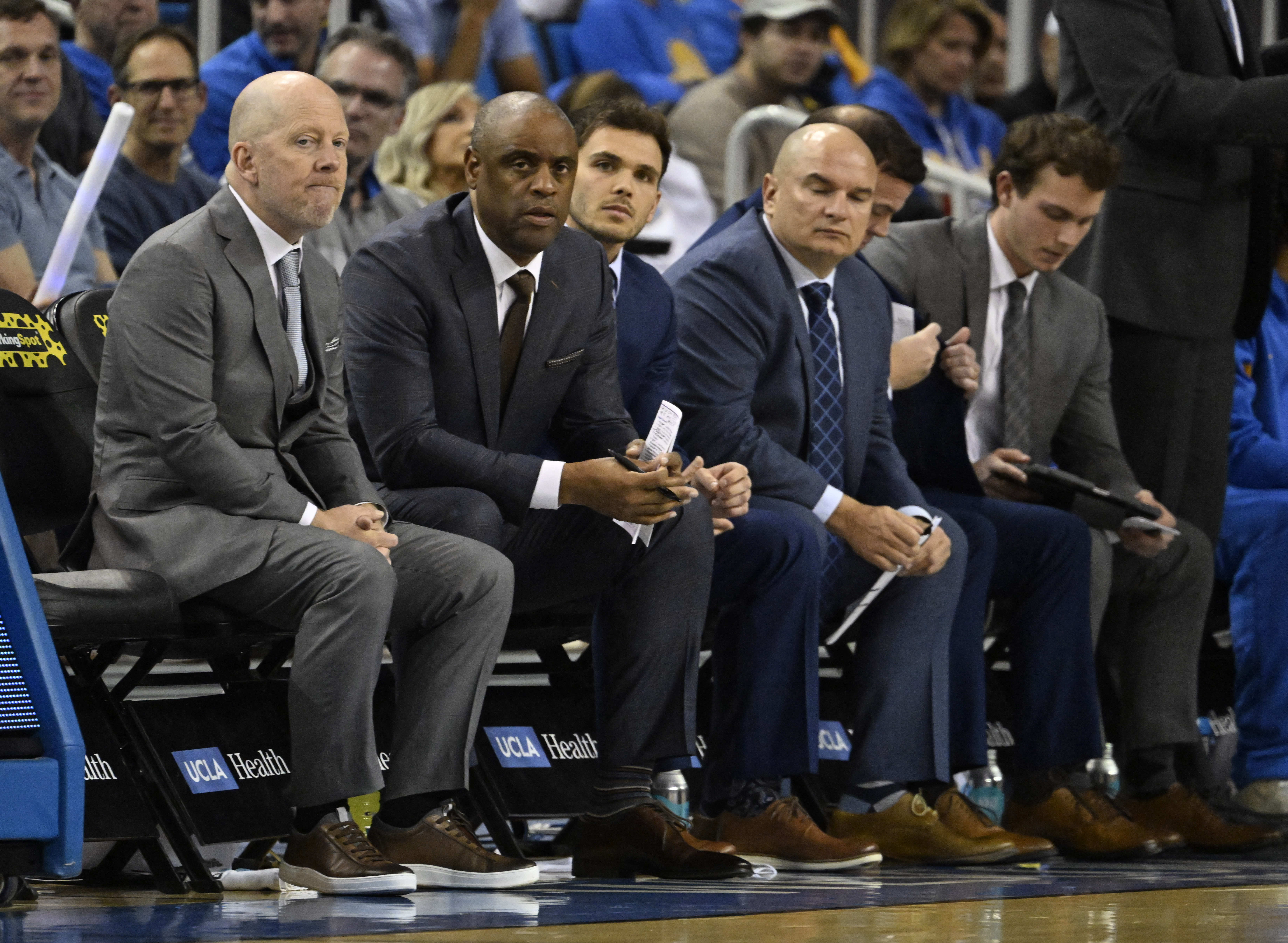 Head coach Mick Cronin of the UCLA Bruins along with...
