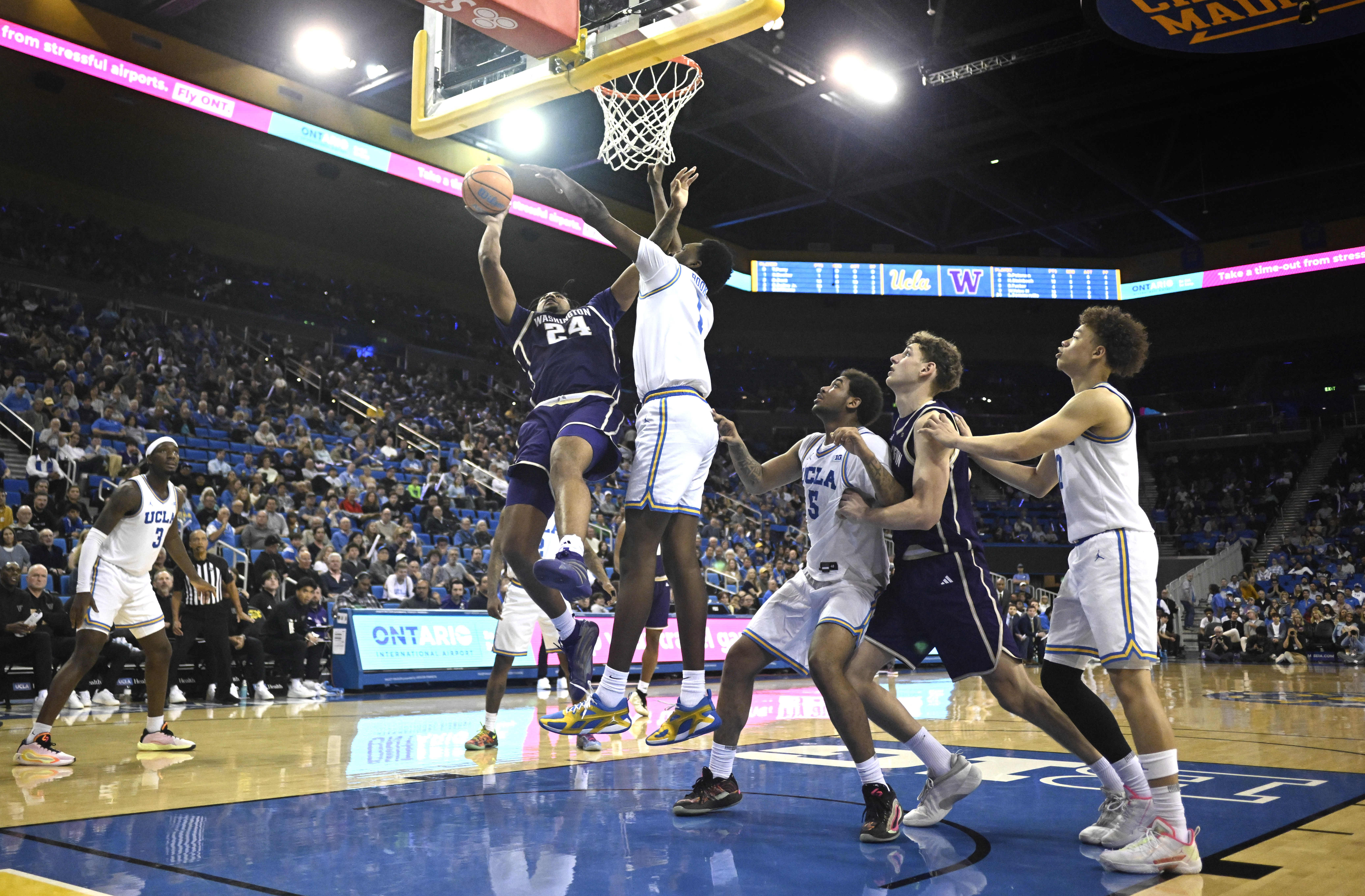Center Lathan Sommerville #24 of the Washington Huskies drives to...