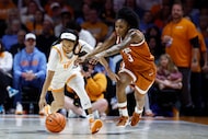 Tennessee guard Mya Pauldo, left, battles for the ball with Texas guard Rori Harmon (3)...