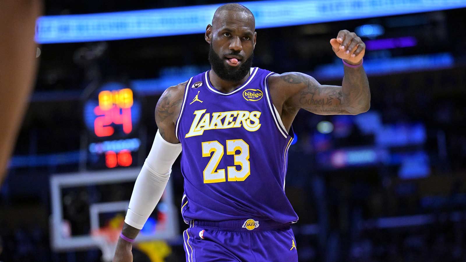 Lakers forward LeBron James (23) reacts on the court after a three-point basket in the first half against the Dallas Mavericks at Crypto.com Arena