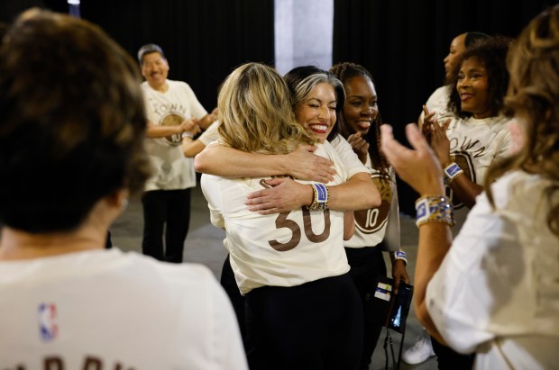 The Hardwood Classics, the senior dance team for the Golden State Warriors, celebrate backstage after their performance during the game between the Utah Jazz and the Golden State Warriors at the Chase Center in San Francisco, Calif., on Monday, Nov. 24, 2025. (Nhat V. Meyer/Bay Area News Group)