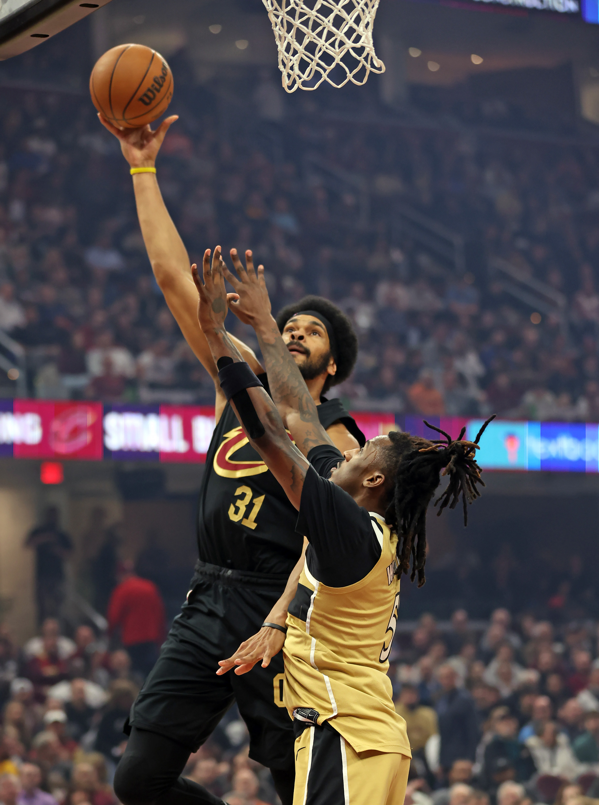 Cleveland Cavaliers center Jarrett Allen goes up for two against Washington Wizards guard Jamir Watkins in the first half of play. 