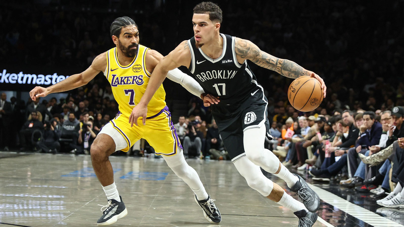 Brooklyn Nets forward Michael Porter Jr. (17) drives past Los Angeles Lakers guard Gabe Vincent (7) in the first quarter at Barclays Center.