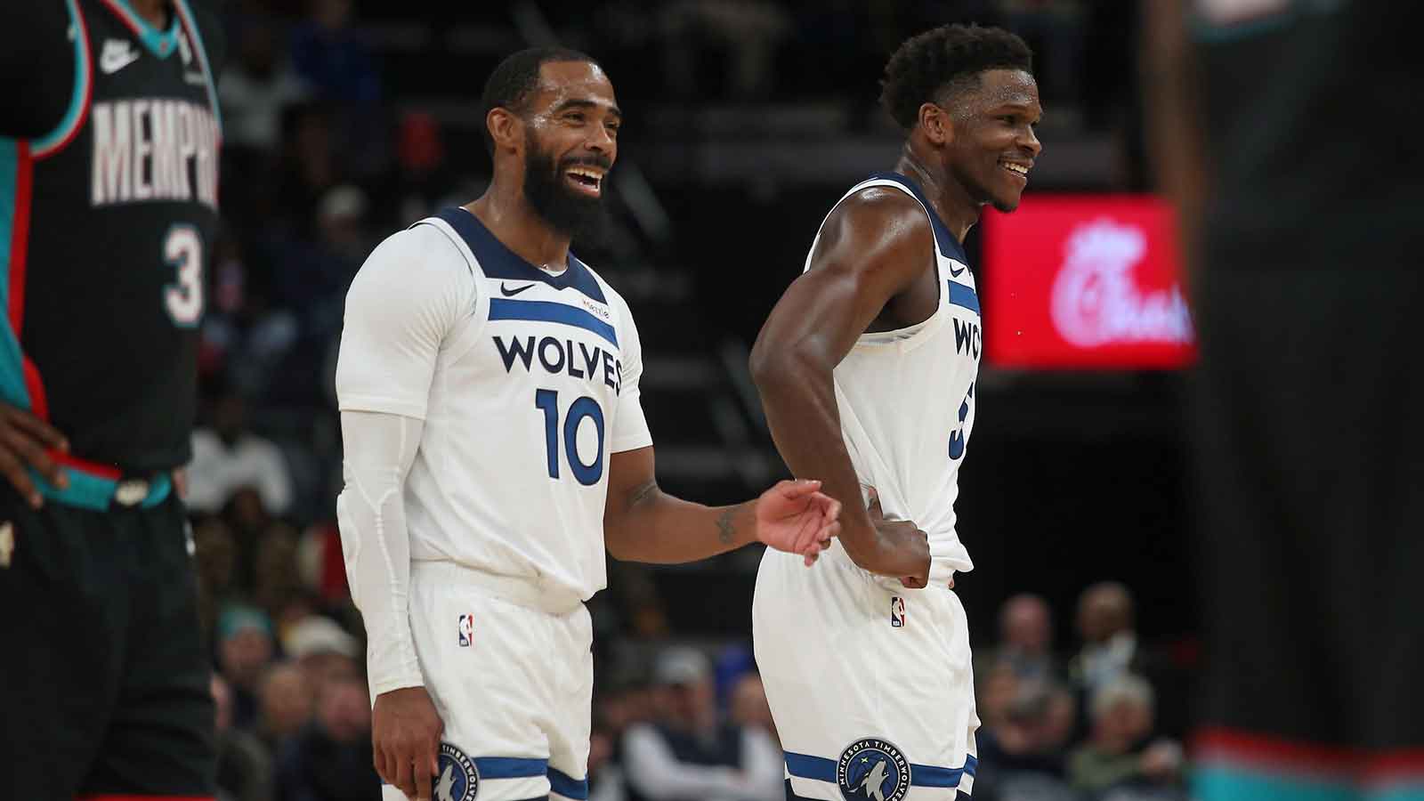 Jan 31, 2026; Memphis, Tennessee, USA; Minnesota Timberwolves guard Mike Conley (10) and guard Anthony Edwards (5) react during the third quarter against the Memphis Grizzlies at FedExForum. Mandatory Credit: Petre Thomas-Imagn Images