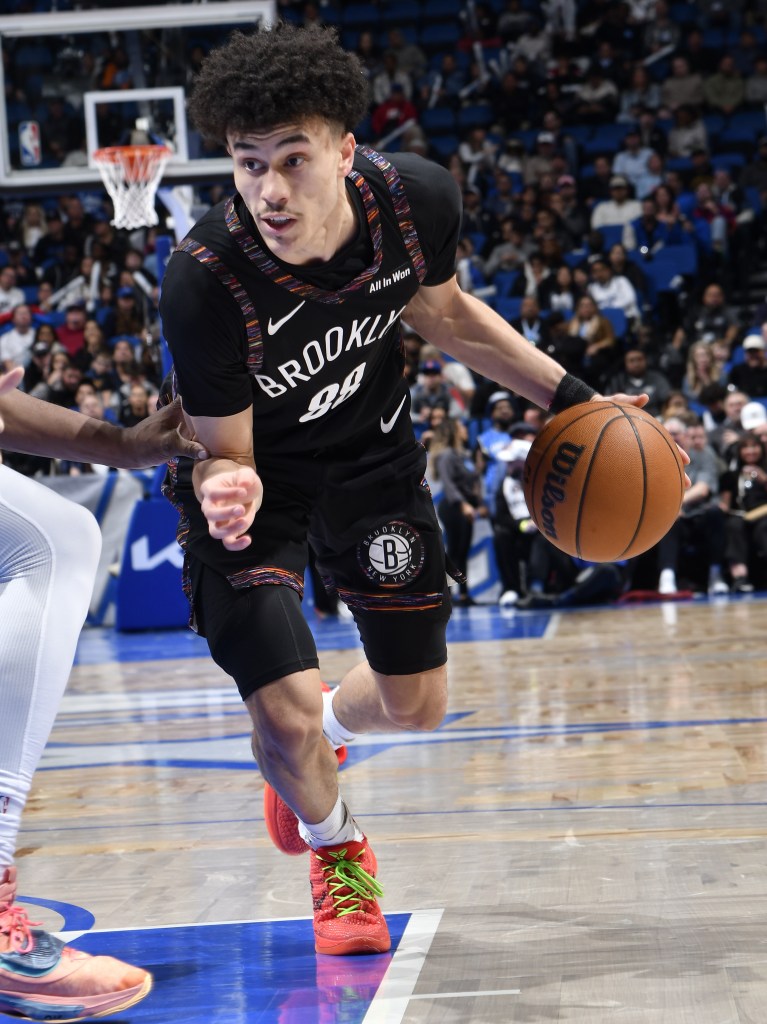 Nolan Traore, who scored 21 points, drives to the basket during the Nets' road loss to the Magic.