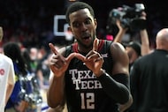 Texas Tech forward Donovan Atwell (12) reacts after defeating Arizona during an NCAA college...