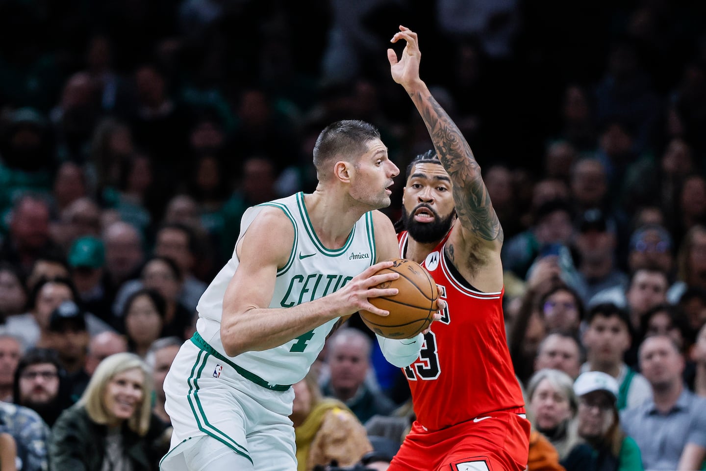 Celtics center Nikola Vucevic (left) had 19 points and 11 rebounds in his first game against his former team after being traded by the Bulls last week.