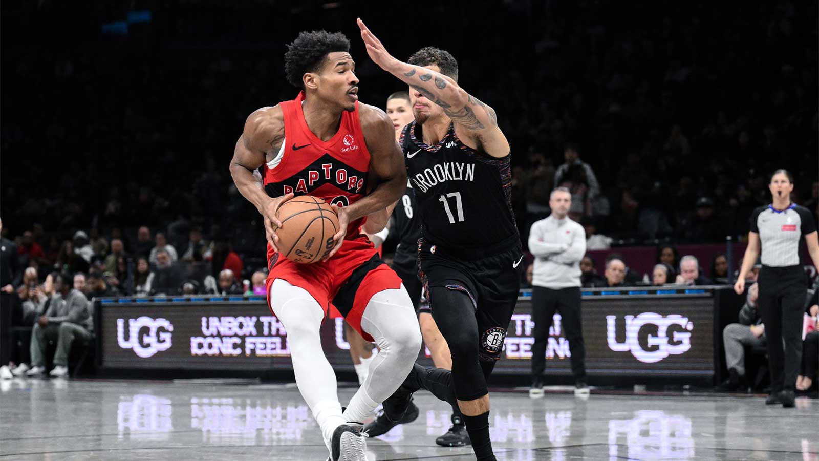 Toronto Raptors guard Ochai Agbaji (30) looks to shoot the ball against Brooklyn Nets forward Michael Porter Jr. (17) during the second half at Barclays Center.