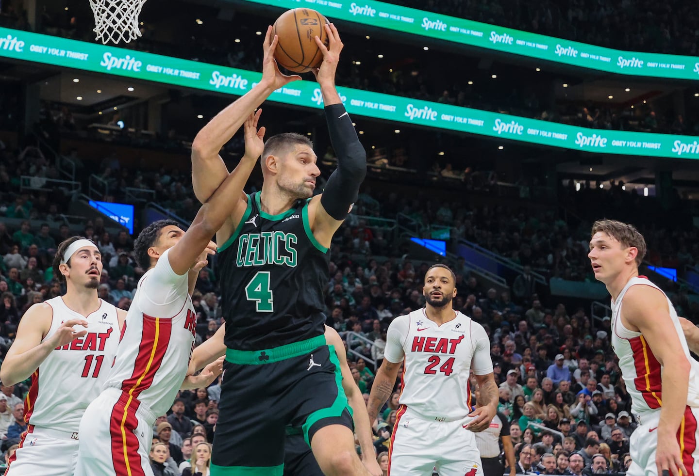 Nikola Vucevic (4) made a strong start to his Celtics career, posting 11 points and 12 rebounds in 28 minutes during Friday's comeback victory over the Heat at TD Garden.