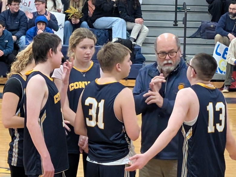 ConVal Head Coach Kevin Carne gives some mid-game advice at the start of the second half. From left Zadie Marshall, Brennan White, Charley Pyle, Josiah Wisenburg, Kevin Carne, C.J. Anderson.
