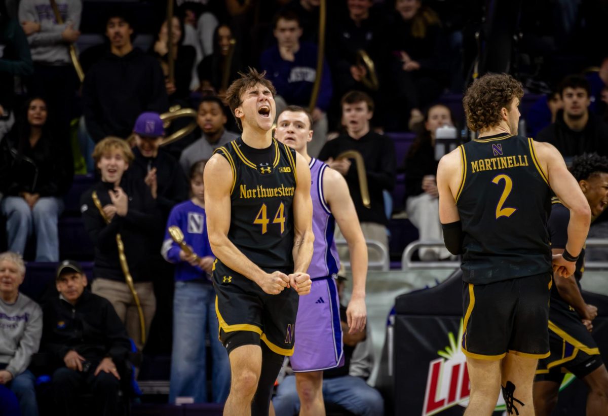 A Northwestern player in black celebrates emphatically.