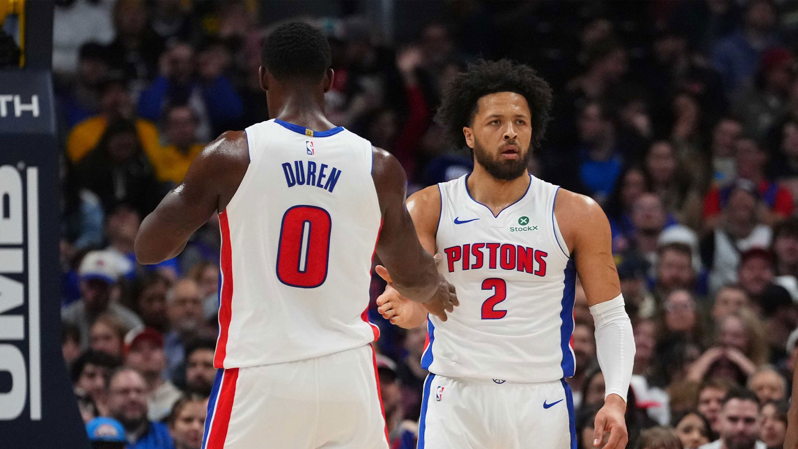 Pistons guard Cade Cunningham (2) and center Jalen Duren (0) react to a foul called in the first quarter against the Denver Nuggets at Ball Arena